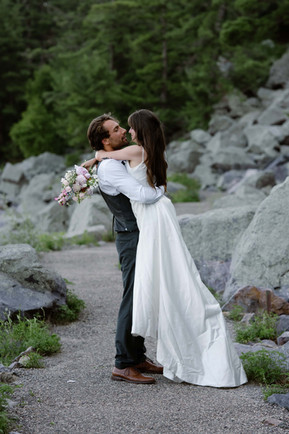bride and groom on tumbled rocks trail devils lake