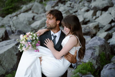 bride and groom on tumbled rocks trail devils lake