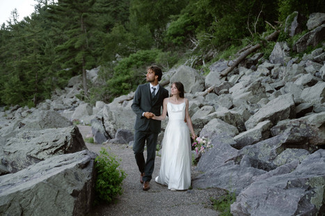bride and groom on tumbled rocks trail devils lake