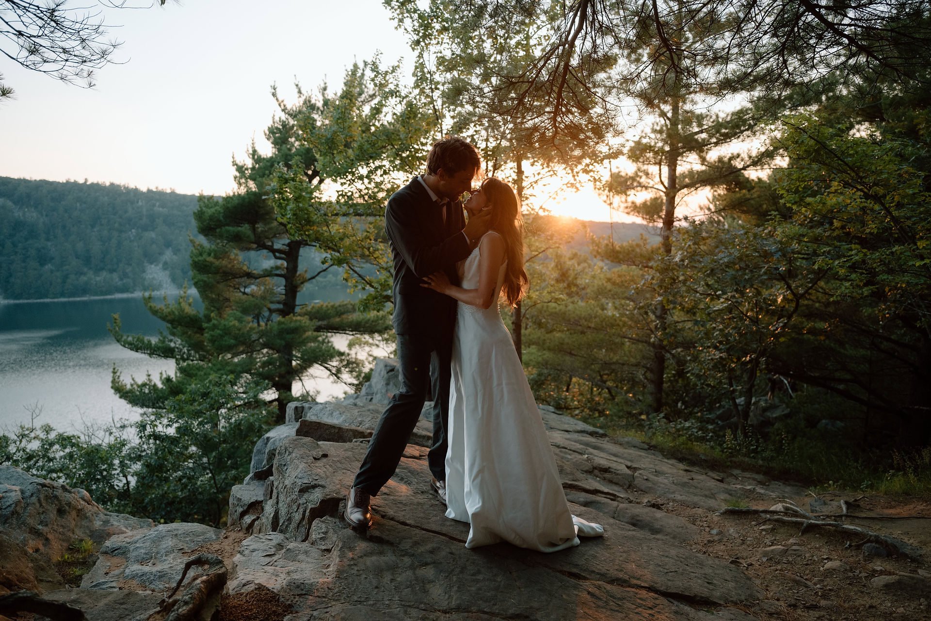 bride and groom at devils lake east bluff trail at sunset