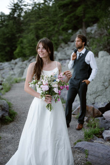 bride and groom on tumbled rocks trail devils lake
