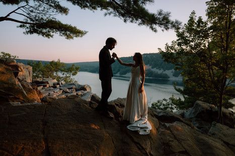 bride and groom at devils lake east bluff trail at sunset