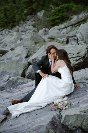 bride and groom on tumbled rocks trail devils lake