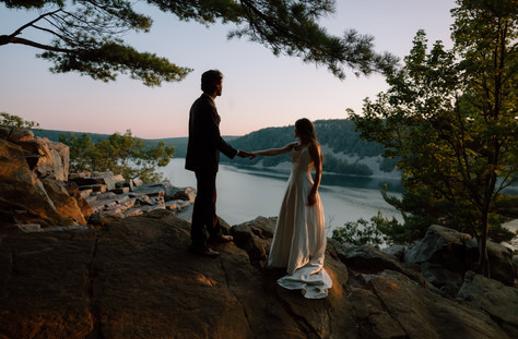 bride and groom at devils lake east bluff trail at sunset