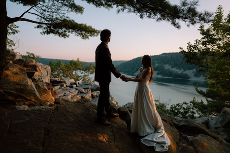 bride and groom at devils lake east bluff trail at sunset