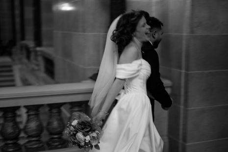 bride and groom running in the wisconsin capitol