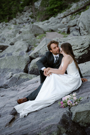 bride and groom on tumbled rocks trail devils lake