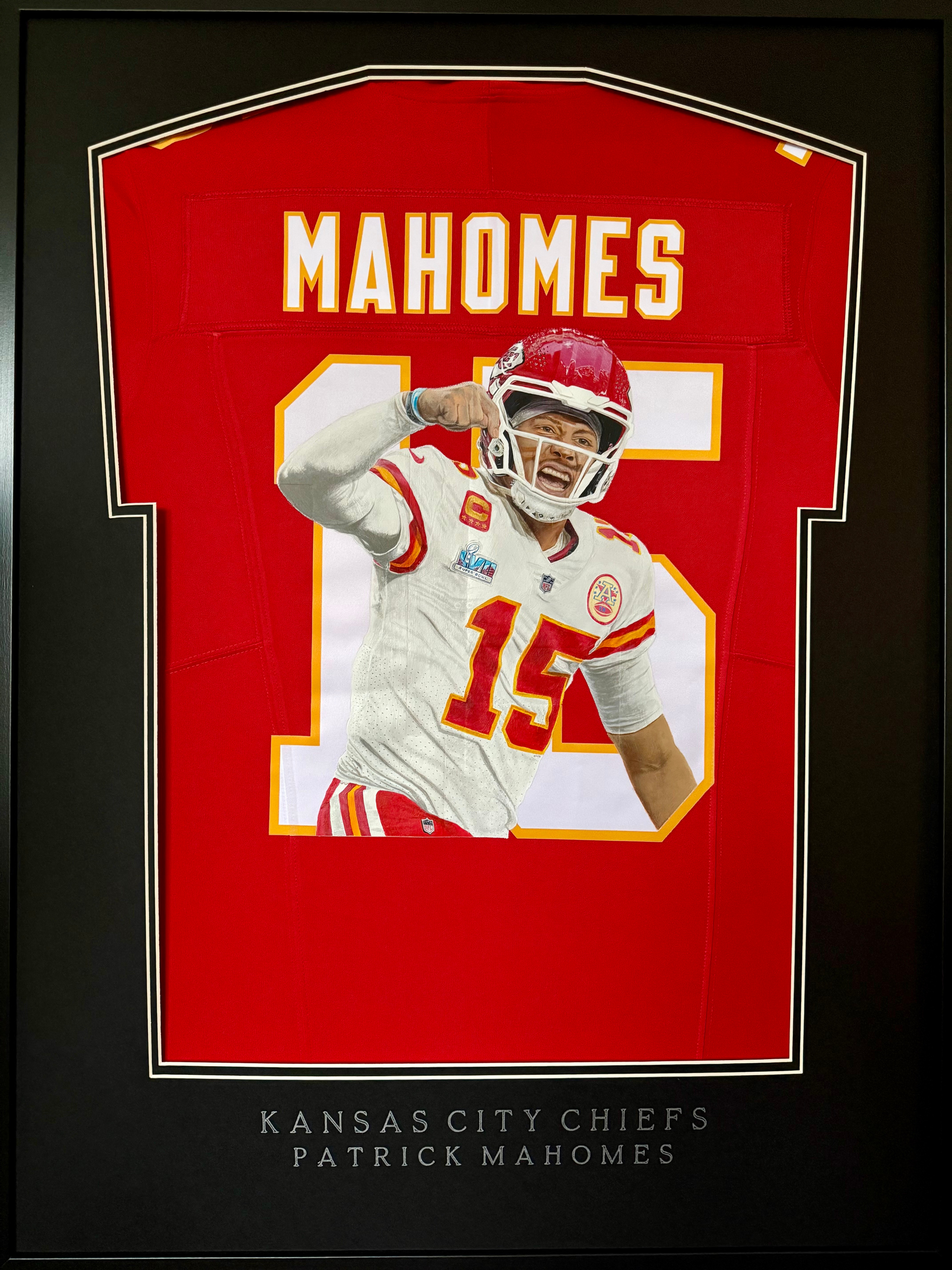 Framed painted jersey of Kansas City Chiefs Quarterback Patrick Mahomes hand painted by Sports Jersey Artist Scott Strachan