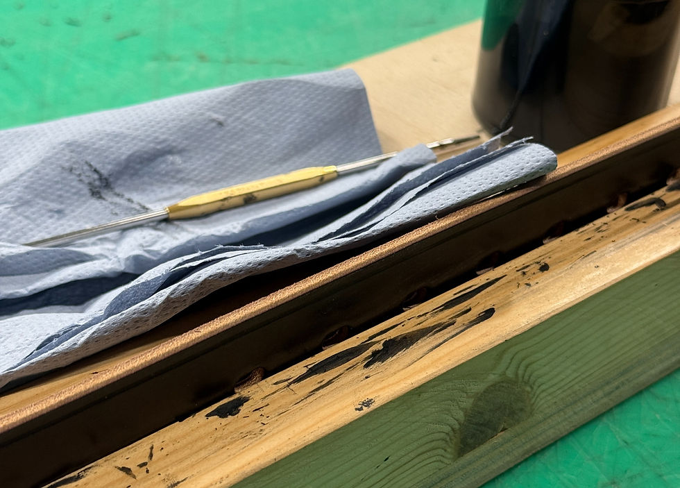 Applying edge paint to a leather belt