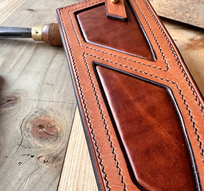 Handmade leather knife sheath by Katy Warriner, crafted using traditional stitching and durable construction for everyday use.