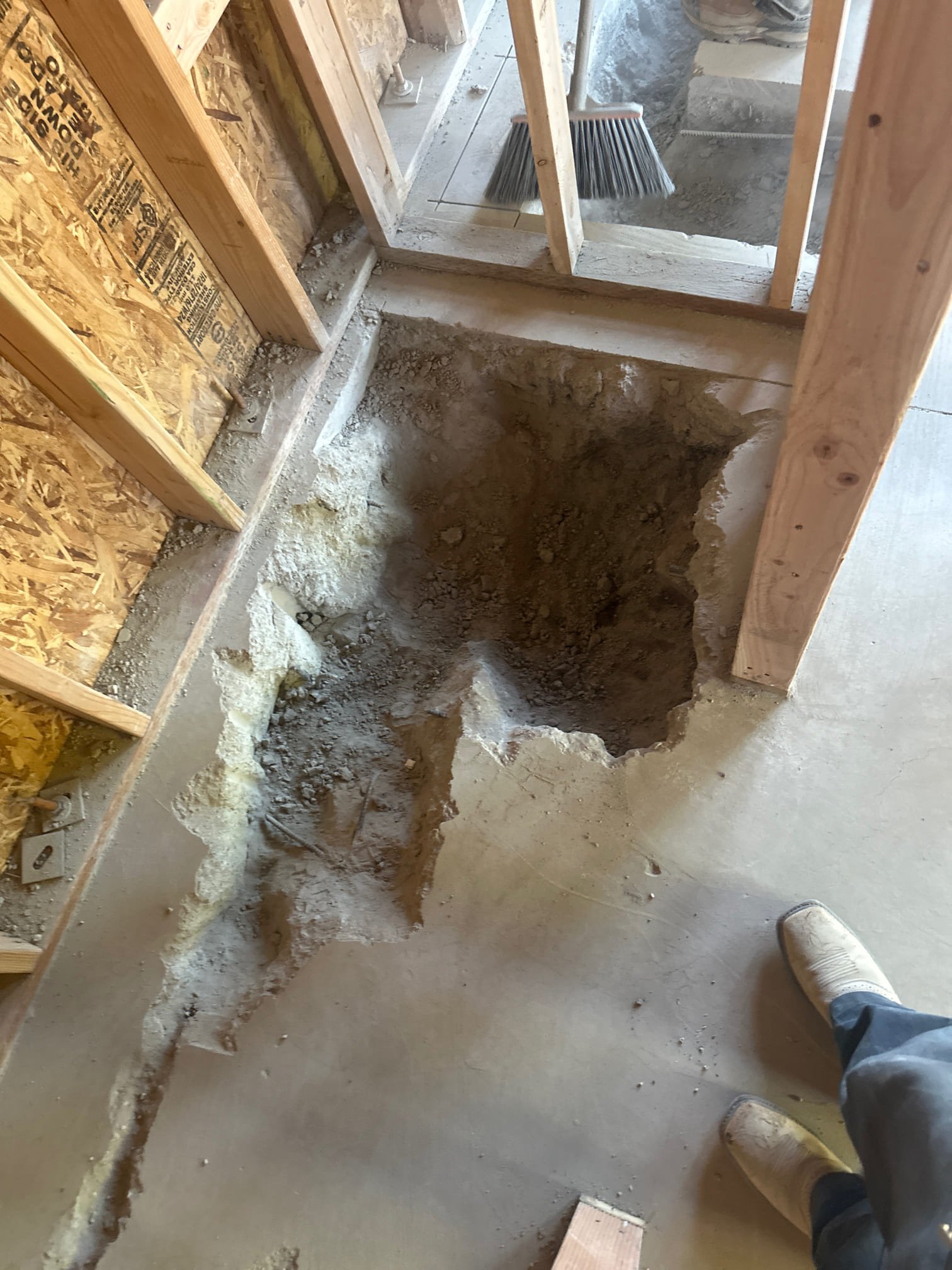 Image depicts a homeowner successfully using a natural, do-it-yourself remedy to clear a clogged pipe. Sunlight streams into the clean, uncluttered space, symbolizing the avoidance of costly professional sewer line repairs and the peace of mind from preventing a potentially disastrous sewer line break under the house.