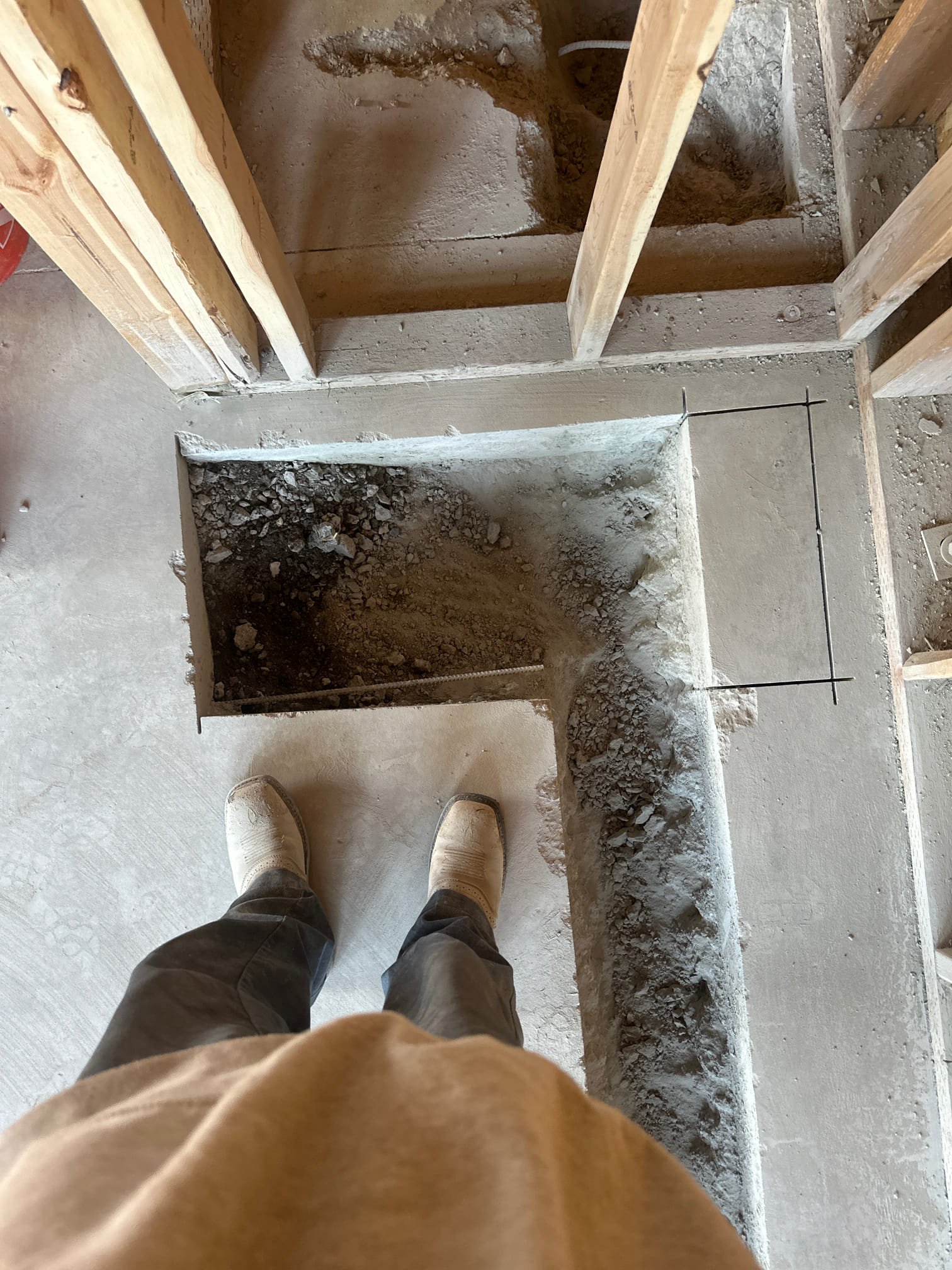 A freshly repaired water main trench with pristine, newly installed pipes gleaming in the sunlight, suggesting a reliable water supply and preventing costly sewer line backups often associated with aging infrastructure. Think of it as preventative care, avoiding future 'main sewer line clog repair cost' concerns. This critical connection is the main artery of your home's plumbing, often referred to as 'the main sewer line in a house,' now revitalized for years of worry-free service.