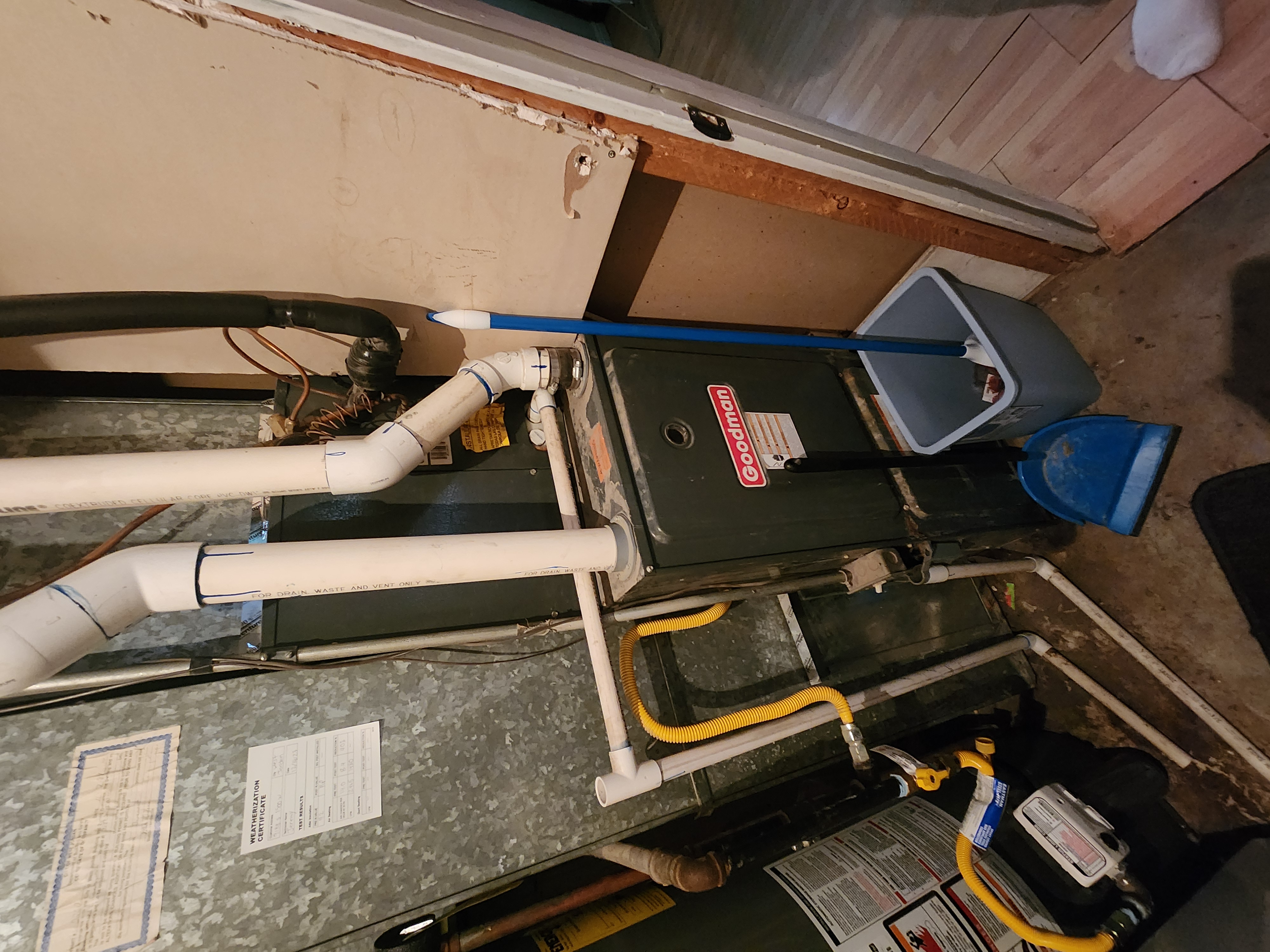 Image showcasing a home's exterior with water beading off a treated wall, highlighting the benefits of waterproofing. A water testing kit and inspection tools are subtly placed nearby, suggesting preventative measures against water damage and the importance of professional cleaning inspections.