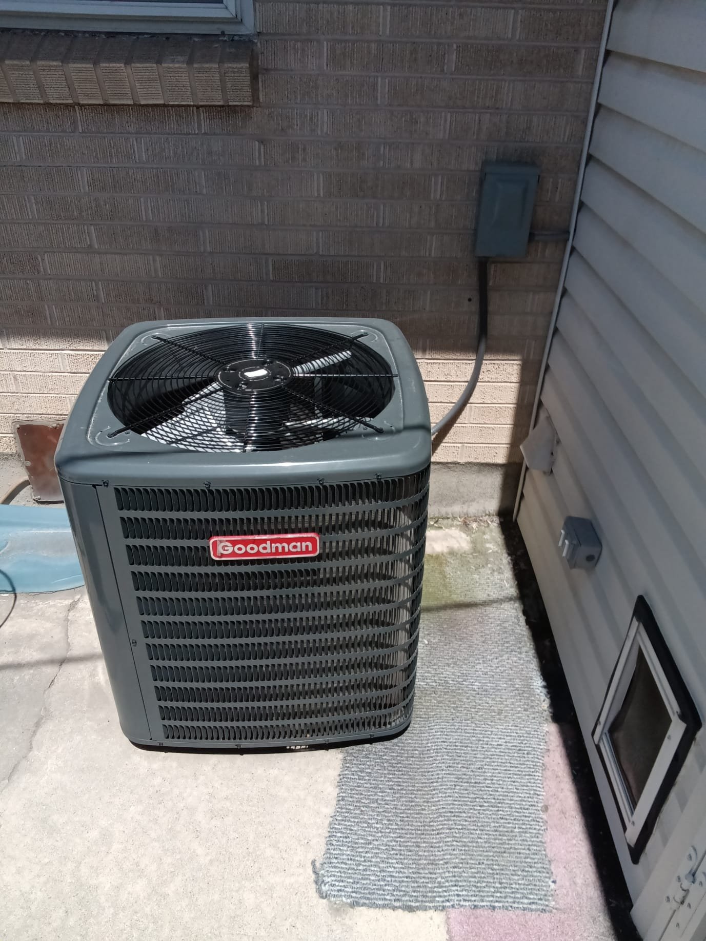 Worried homeowner relieved as a friendly technician quickly repairs their furnace, restoring warmth and comfort. A 24/7 emergency service van is parked outside, symbolizing fast, reliable help.