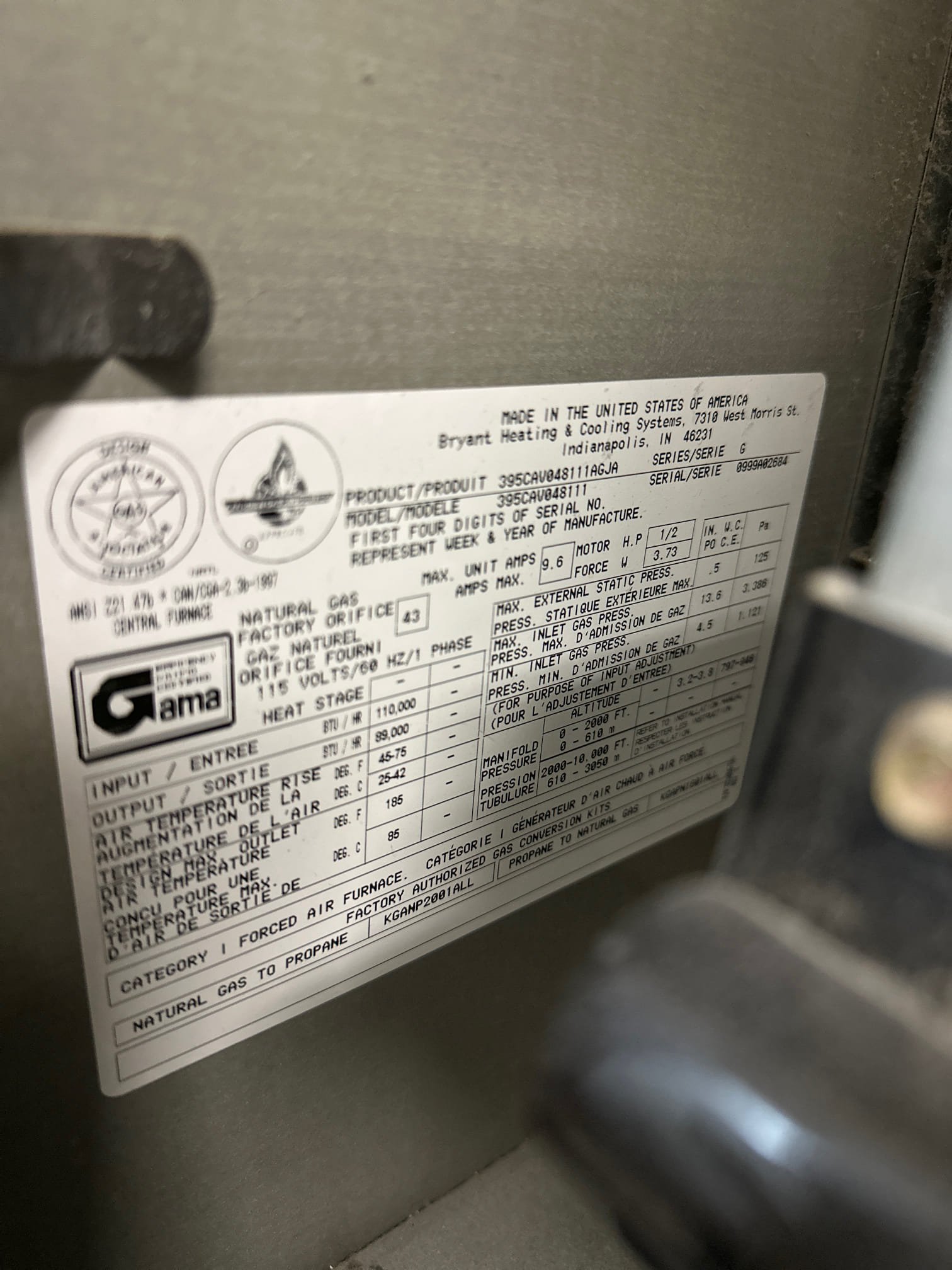 Image depicting an aircon specialist inspecting or installing a mini-split air conditioning unit, possibly in a commercial setting. Focus is on expertise in mini split systems and commercial air conditioning inspection, highlighting professional HVAC services.