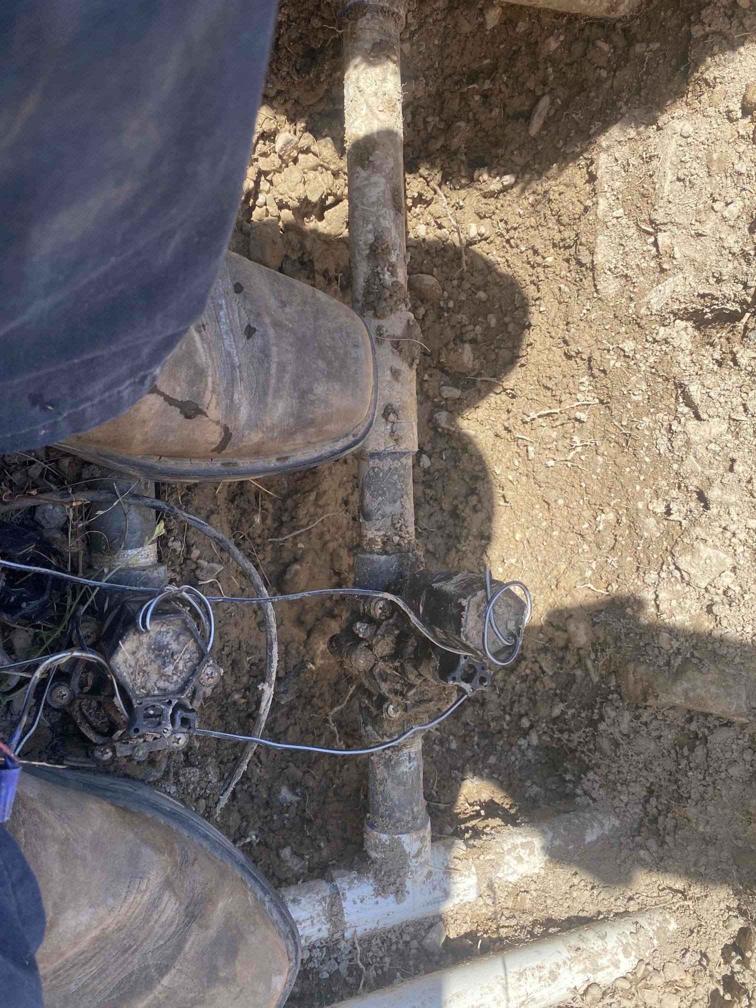 A clean water sample vial sits beside a home water test kit, implying that testing well water can help prevent ceiling water damage. This proactive measure, like a ceiling water damage restoration inspection, ensures the safety and purity of your home's water supply, protecting against costly repairs.