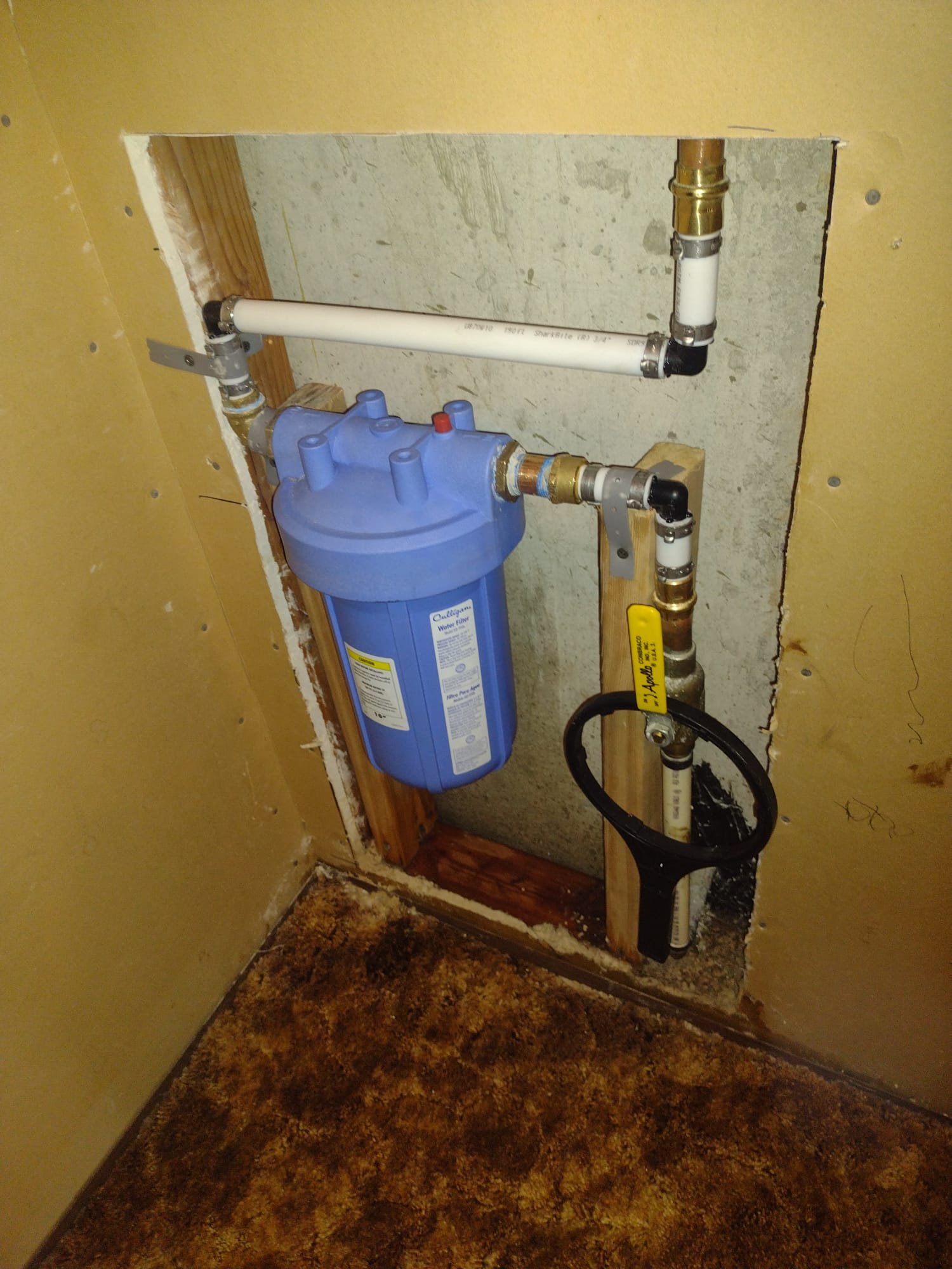 Clean, bright basement with newly repaired drywall, showcasing successful water damage remediation. Repaired section blends seamlessly, highlighting professional quality and restored space value. Indicates effective maintenance and potential for cost-effective solutions.