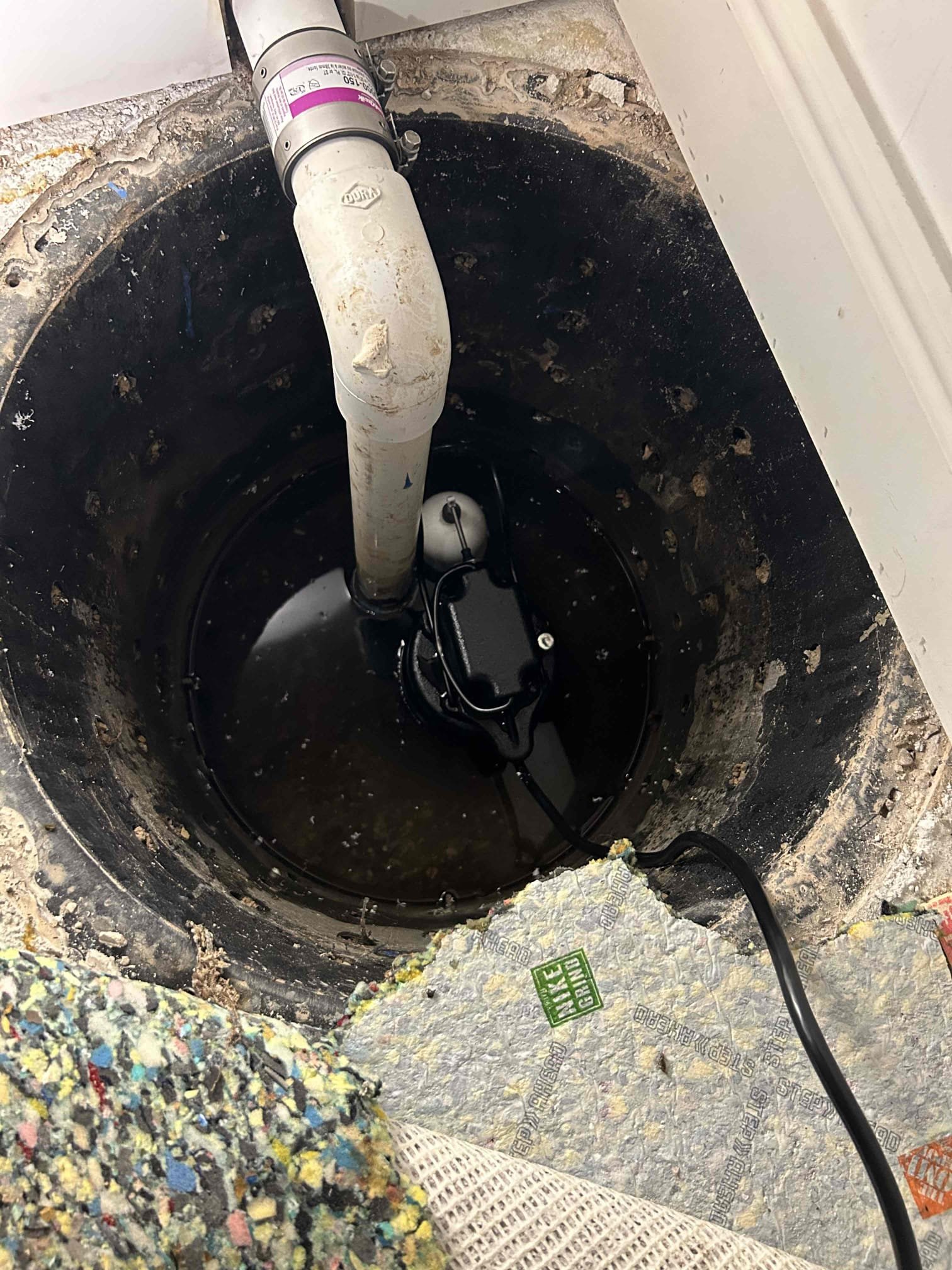 A commercial property owner smiles, relieved, as a technician assesses their sewage tank. Clean, well-maintained equipment suggests efficient diagnosis, hinting at fair commercial sewage backup cleanup pricing and the long-term benefits of regular sewage tank maintenance.