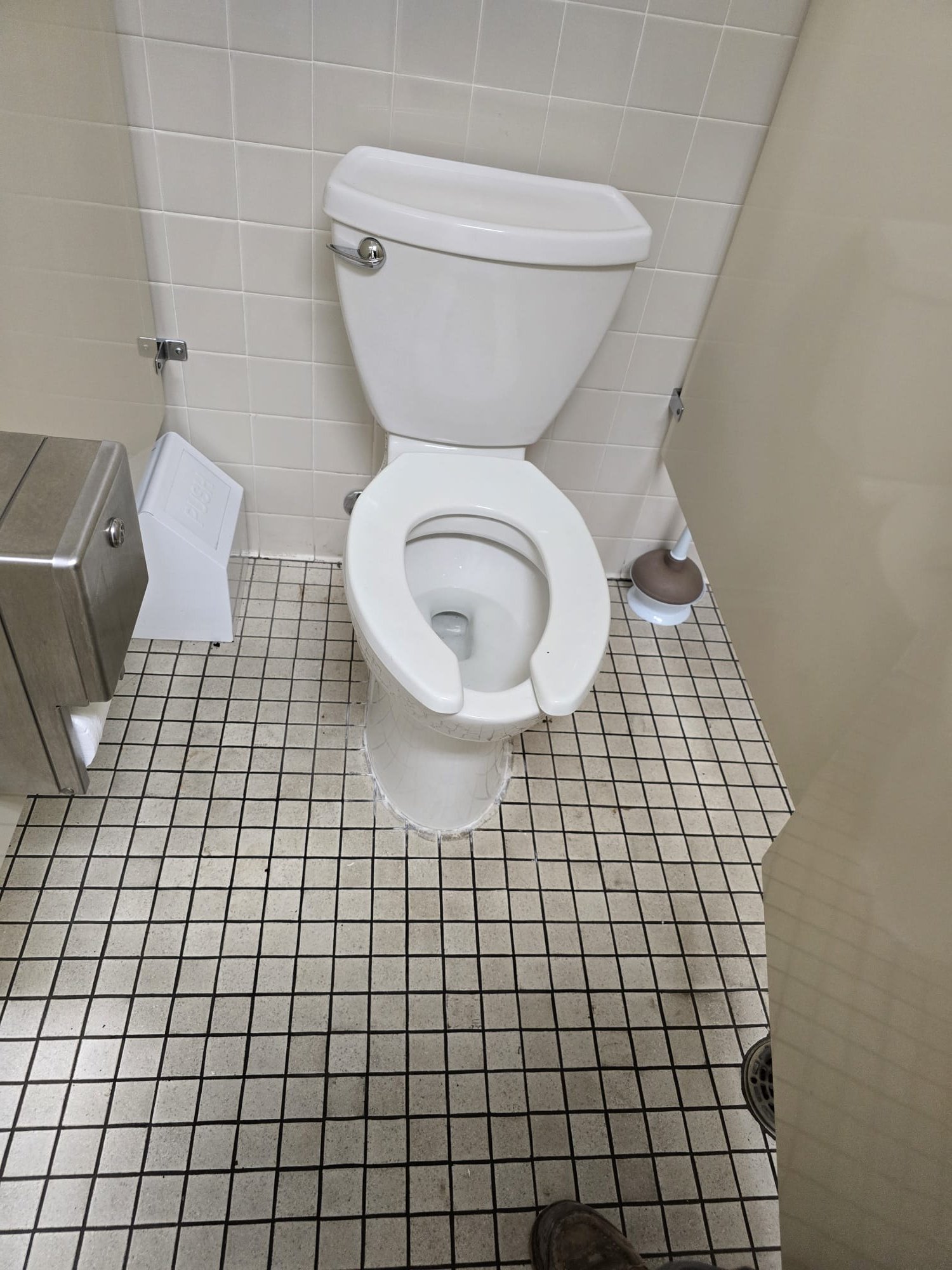 High-pressure water stream powerfully clears a clogged sewer pipe, showcasing the effectiveness of power jetting. Debris is blasted away, revealing clean pipe walls, illustrating the benefits of hydro jetting services for restoring optimal flow.