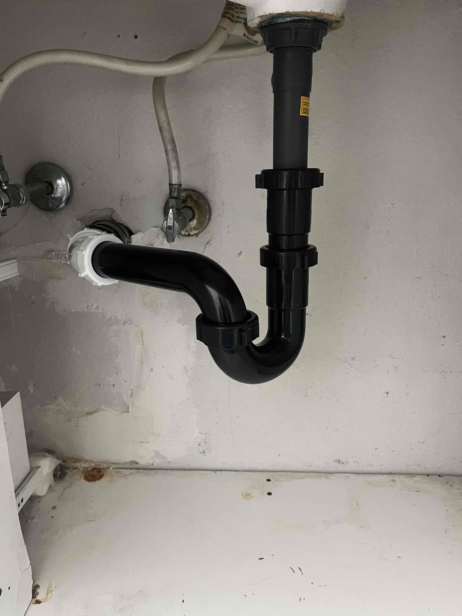 Clean, bright basement after mold remediation, highlighting a family enjoying the space. A small graphic subtly indicates potential government tax credits for energy-efficient home improvements, linking to basement mold recovery troubleshooting resources.