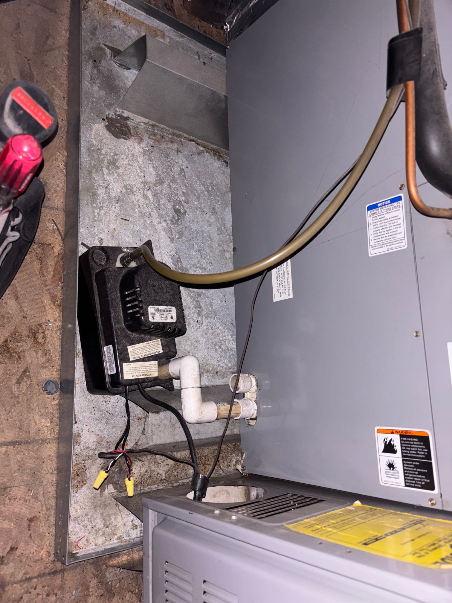 A skilled commercial HVAC technician performing an AC inspection as part of a commercial reconstruction service. Ensuring optimal performance and identifying potential issues for businesses.