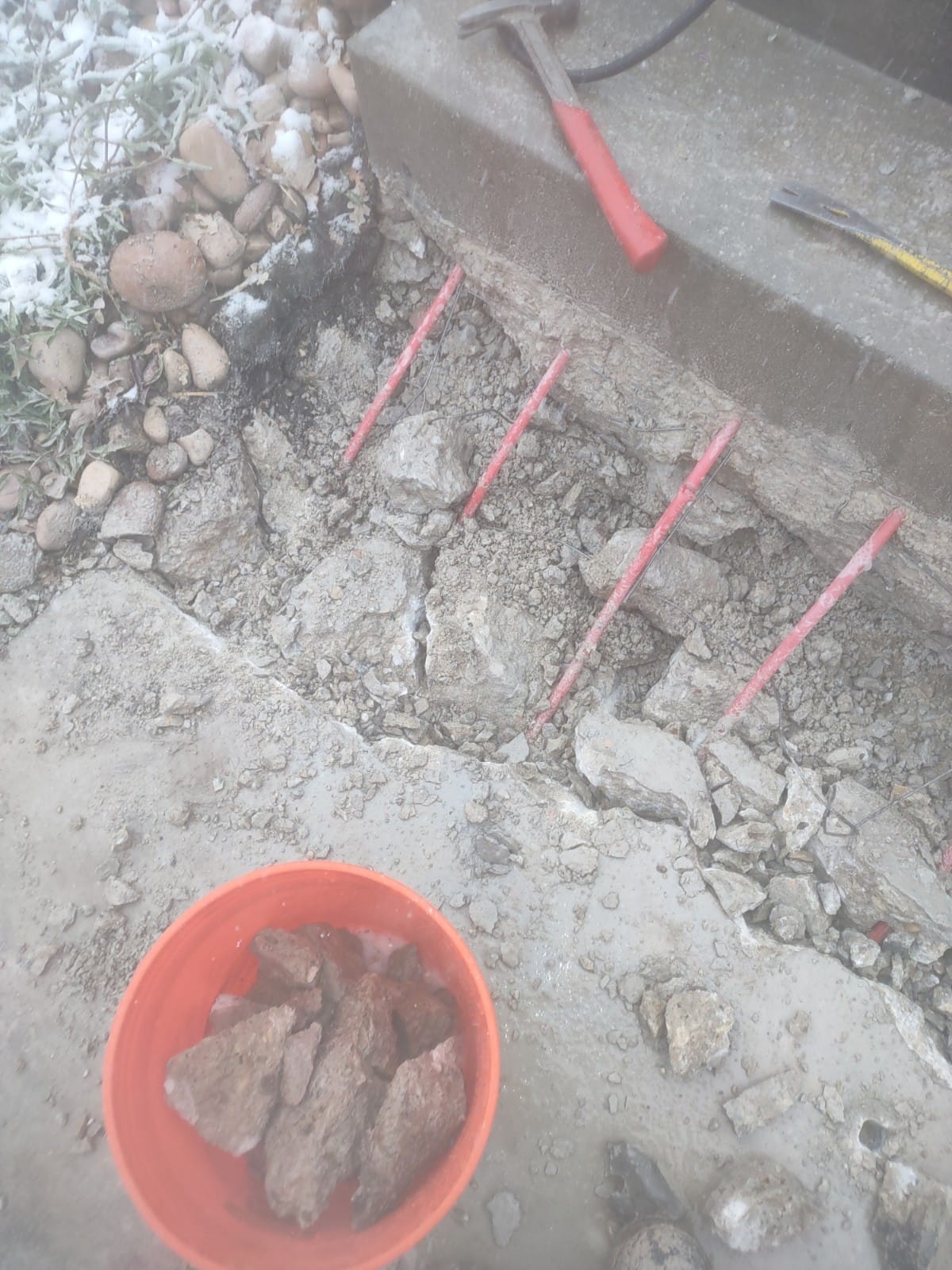 A warm, inviting garage with a powerful outdoor heater radiating heat, contrasting the potential discomfort of a malfunctioning home heater and the need for residential heating inspection repair. The image highlights the benefit of alternative heating solutions during a home heating crisis.