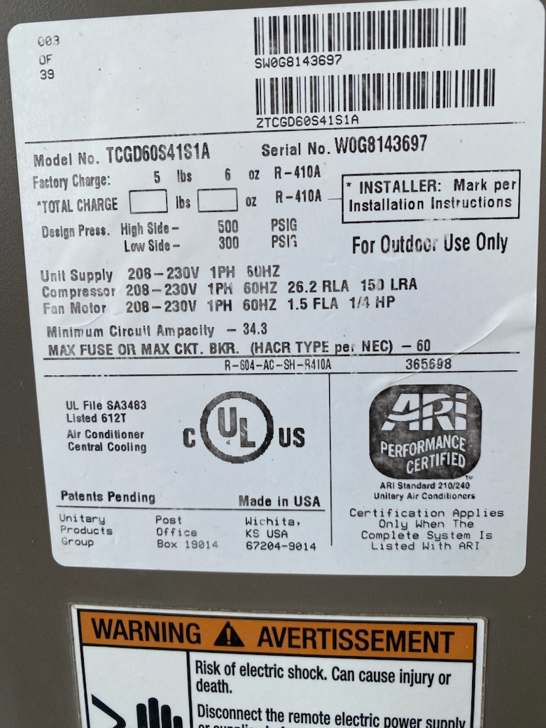 A focused heat lamp warms a person reading a book in a cozy chair, illustrating the benefits of local heating and HVAC zoning for personalized comfort and energy savings, hinting at potential heating AC repair benefits.