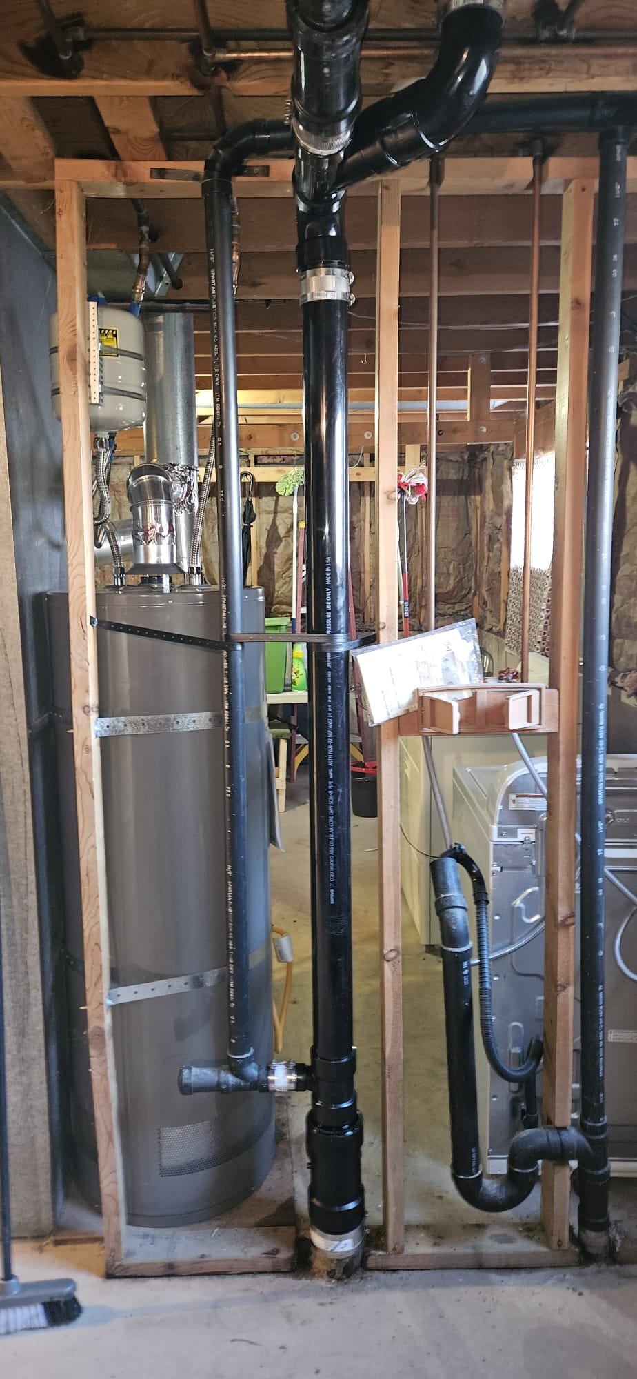 Image of a pristine sewer main line after cleaning and lining, connected to a cleanout and featuring a functional main sewer line trap. The smooth, new lining visually demonstrates improved flow and reduced risk of blockages, highlighting the benefits of sewer maintenance.