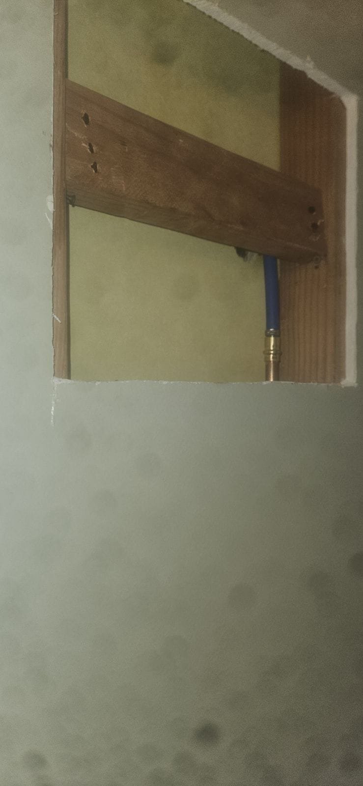 Shiny metal hair stopper sits in a clean drain, preventing clogs that can lead to costly water damage repairs. A sink stopper hair catcher allows for easy hair removal, preventing plumbing problems.