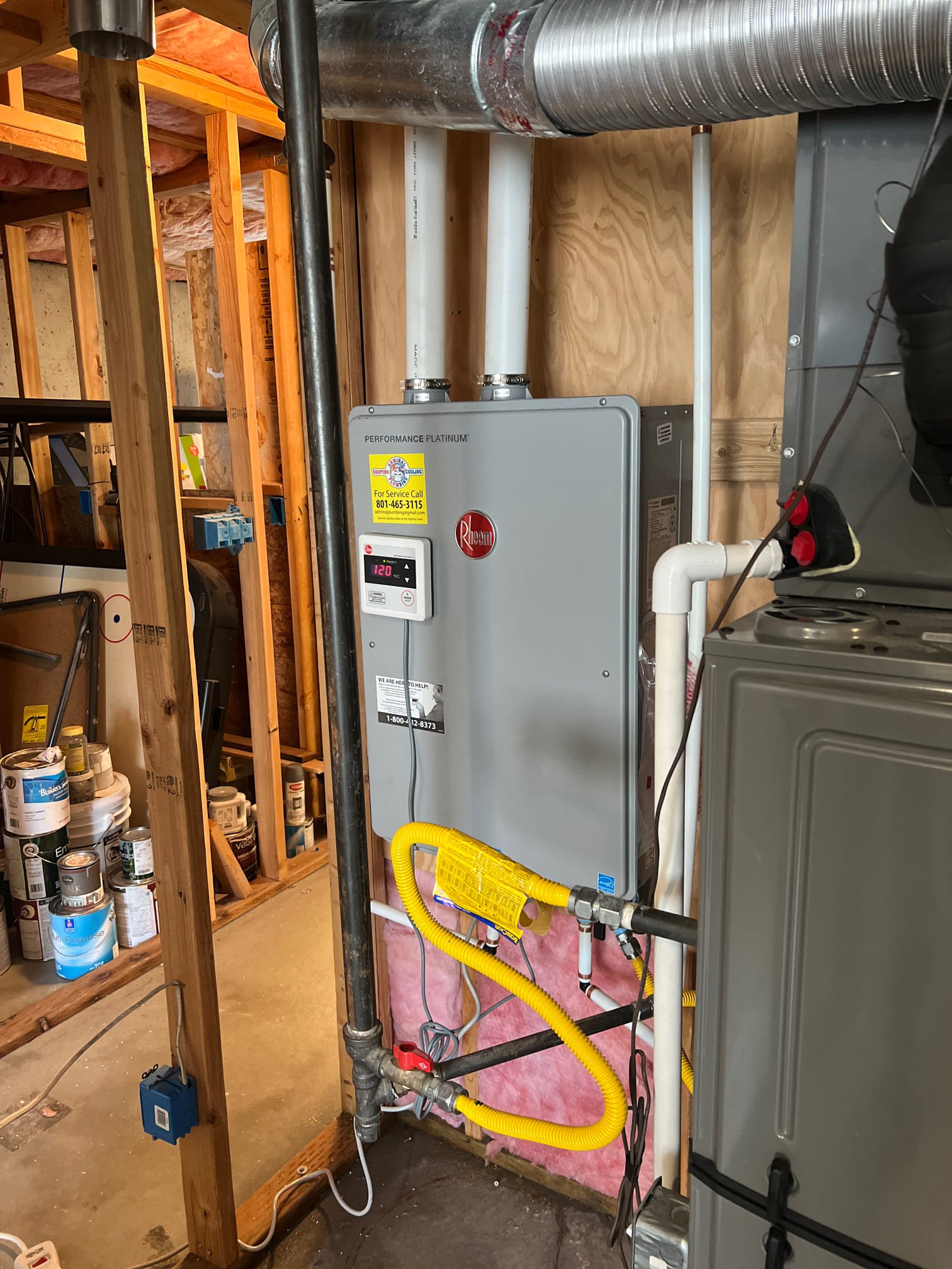 A modern tankless water heater, highlighting the space-saving design and efficiency that impacts the overall electric tankless water heater installation cost. An alternative to traditional tank water heaters, offering on-demand hot water and potential cost savings.