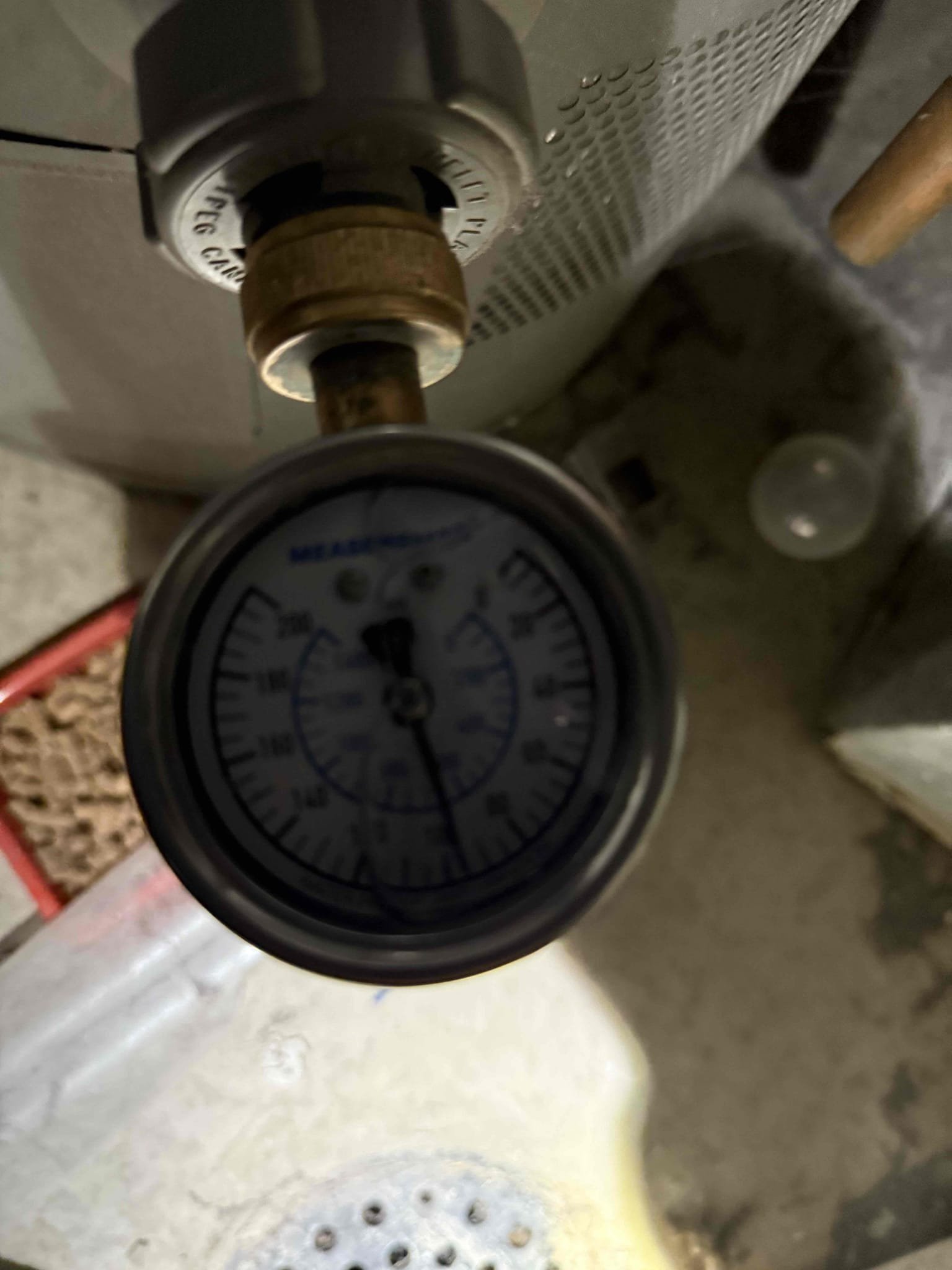 Image showcasing a plumber using a smoke test machine to detect leaks in pipes, with text overlay promoting affordable $99 drain cleaning and comprehensive heating & cooling services.
