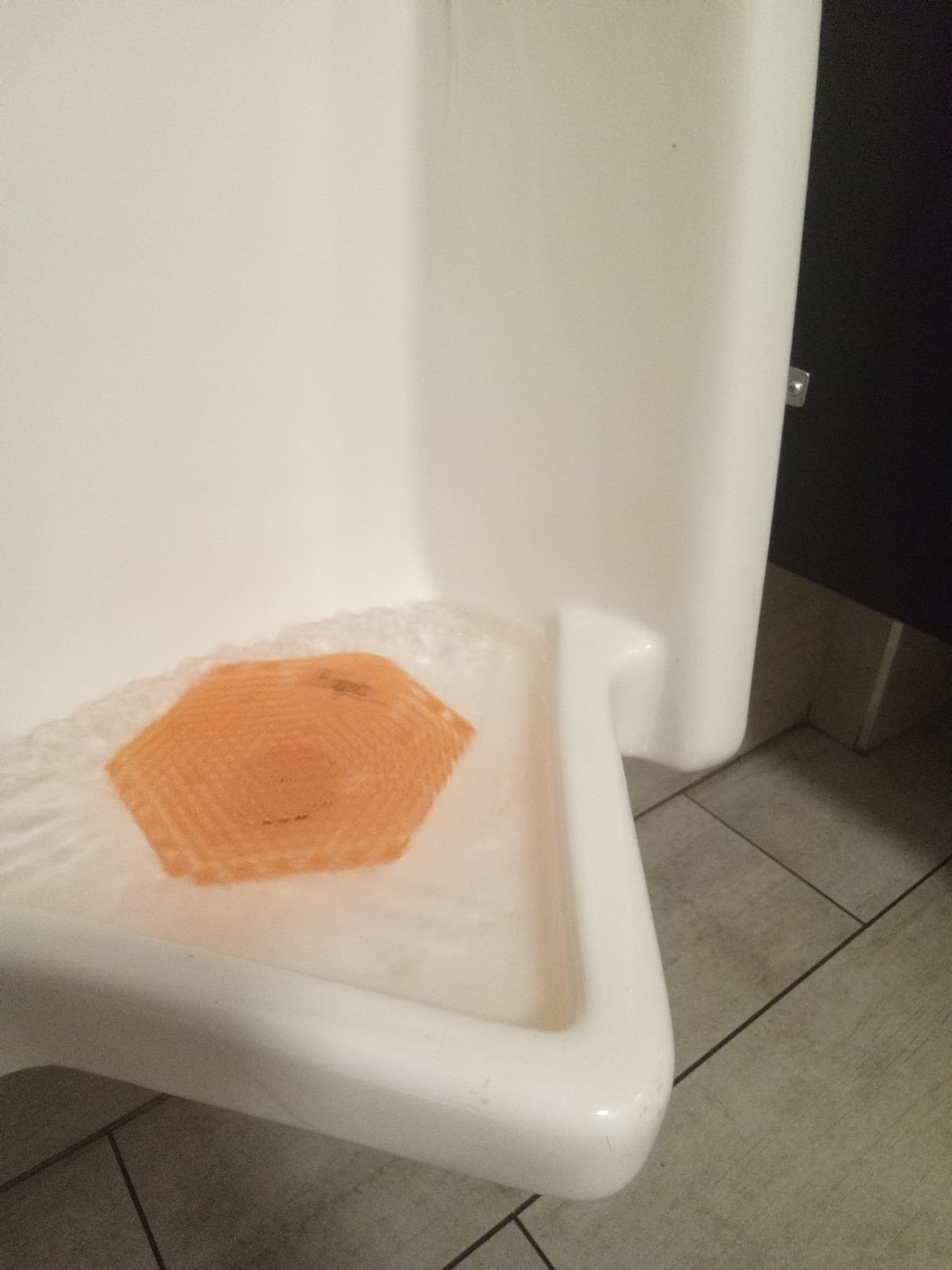 Sparkling clean bathroom tiles, free of mold, surround a pristine sink, suggesting the effectiveness of Drano bathroom sink unclogger in maintaining a hygienic and beautiful space.