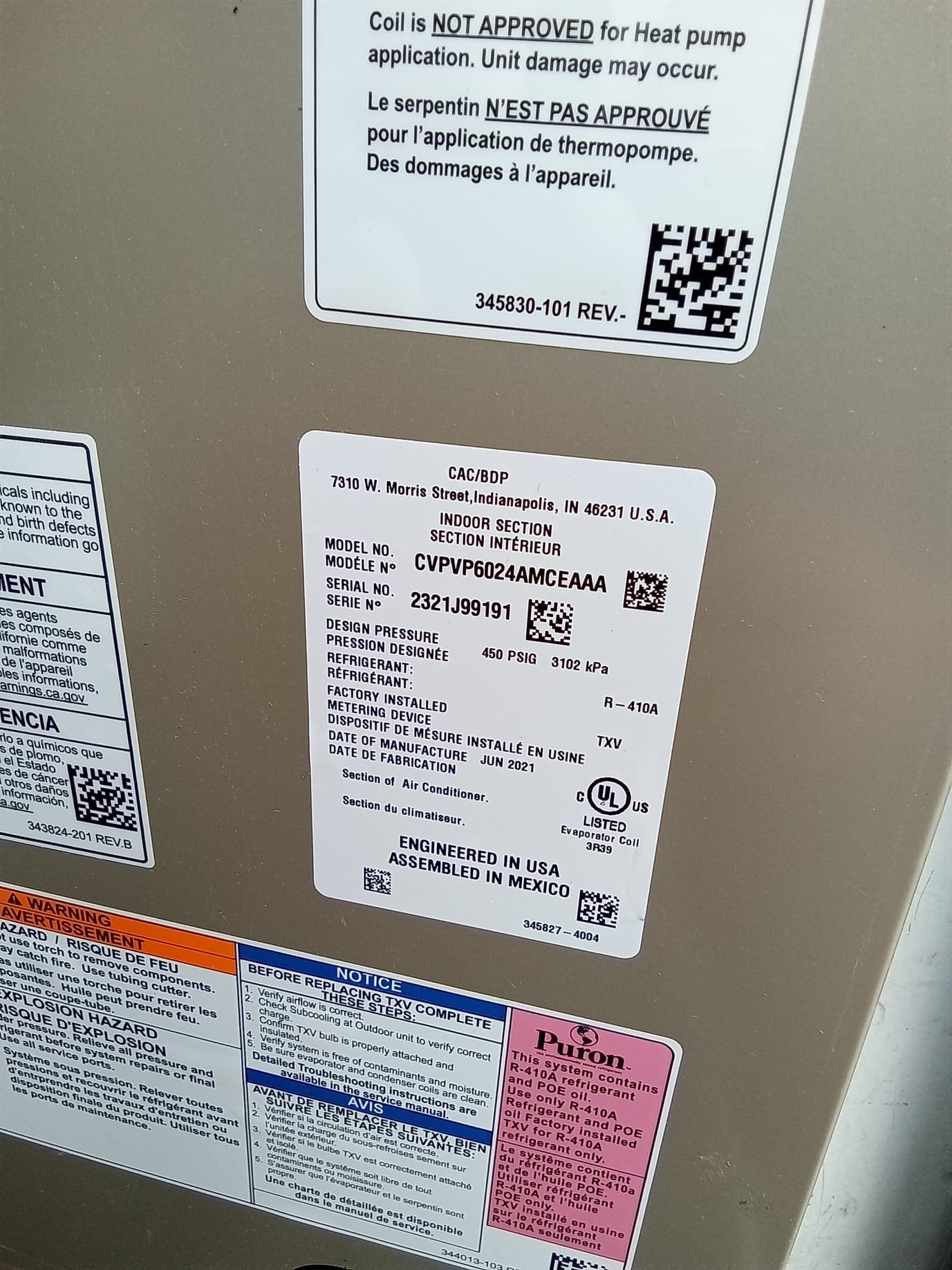 A modern office space with sleek, wall-mounted mini-split air conditioning units providing efficient climate control. The image highlights the units' discreet design and even temperature distribution, suggesting energy savings and a comfortable work environment. A technician in the background performs a commercial air conditioning inspection, emphasizing professional installation and maintenance.