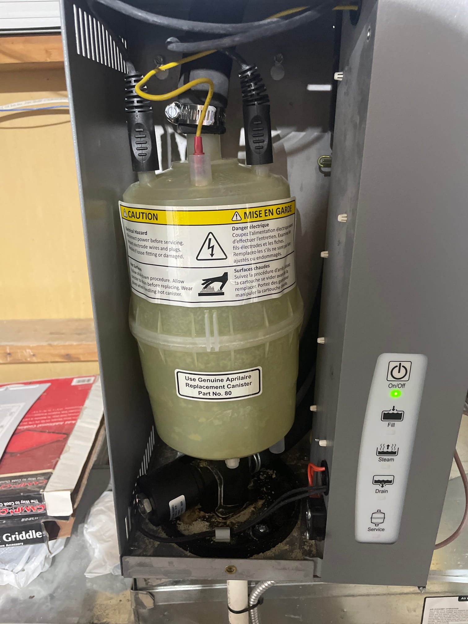 A sleek, portable air conditioner and heating unit stands in a modern living room, subtly implying clean air and comfortable temperature control. The bright, uncluttered space suggests easy maintenance and a healthy home environment. Visual cues highlight the benefits of combined heating and air purification.