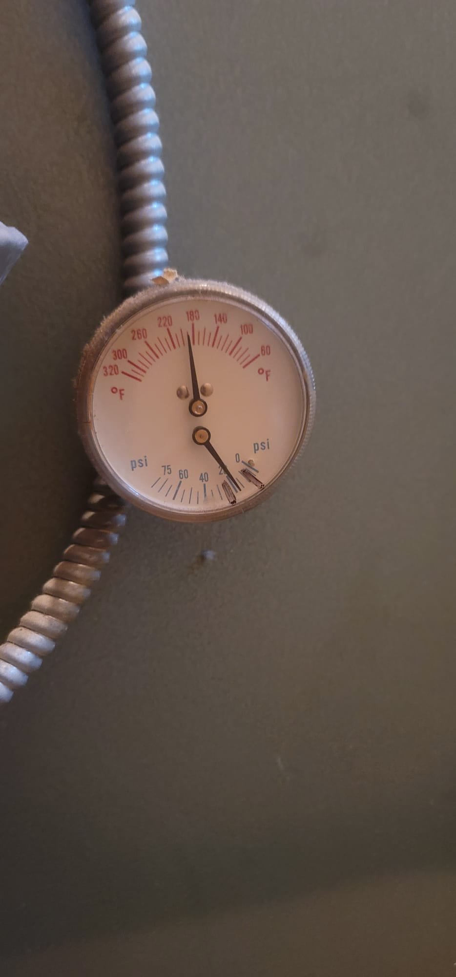 A modern, wall-mounted tankless combi boiler, highlighting its compact size and clean design. This efficient system offers an alternative to bulky oil boilers, potentially impacting boiler replacement price and eliminating the need for separate oil boiler filter replacement. Visual emphasis on space-saving and sleek aesthetics.