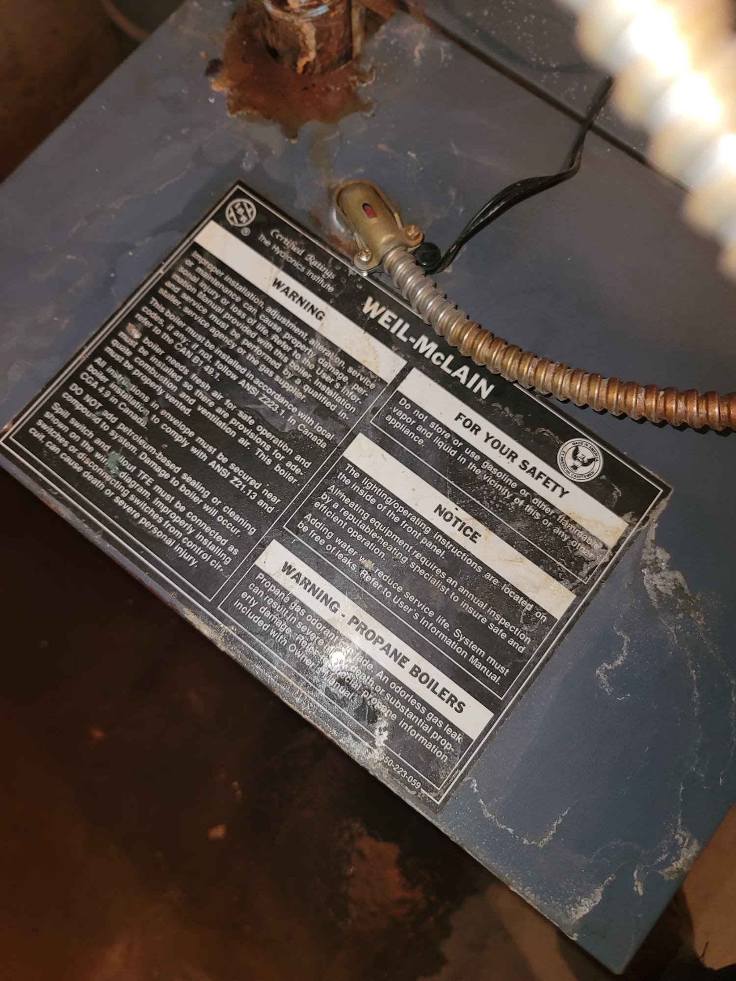 A clogged sink and the need for residential boiler inspection highlight potential plumbing issues. A water boiler plugged in nearby symbolizes essential home systems requiring maintenance for optimal function and to prevent problems.