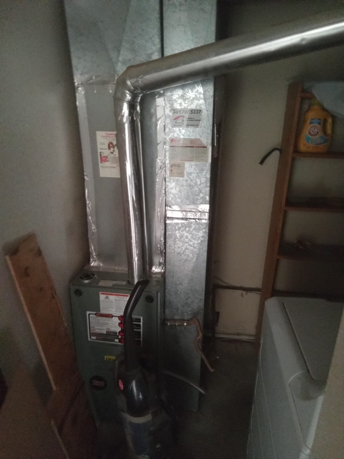 Image of water heater plumbing. A plumbing system connected to a hot water heater, showcasing pipes and valves for residential or commercial use. Essential for understanding plumbing related to water heaters.