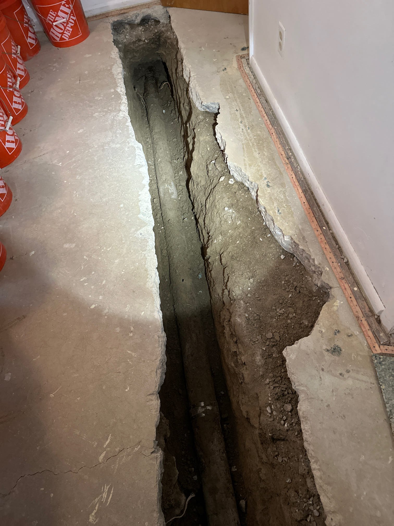 Image of a mobile home water filtration system connected to the main water line, showcasing clean, clear water flowing from a faucet. The system is compact and efficiently installed, suggesting a whole-home solution. The surrounding area is dry and well-maintained, subtly implying effective flood prevention and easier residential cleanup.