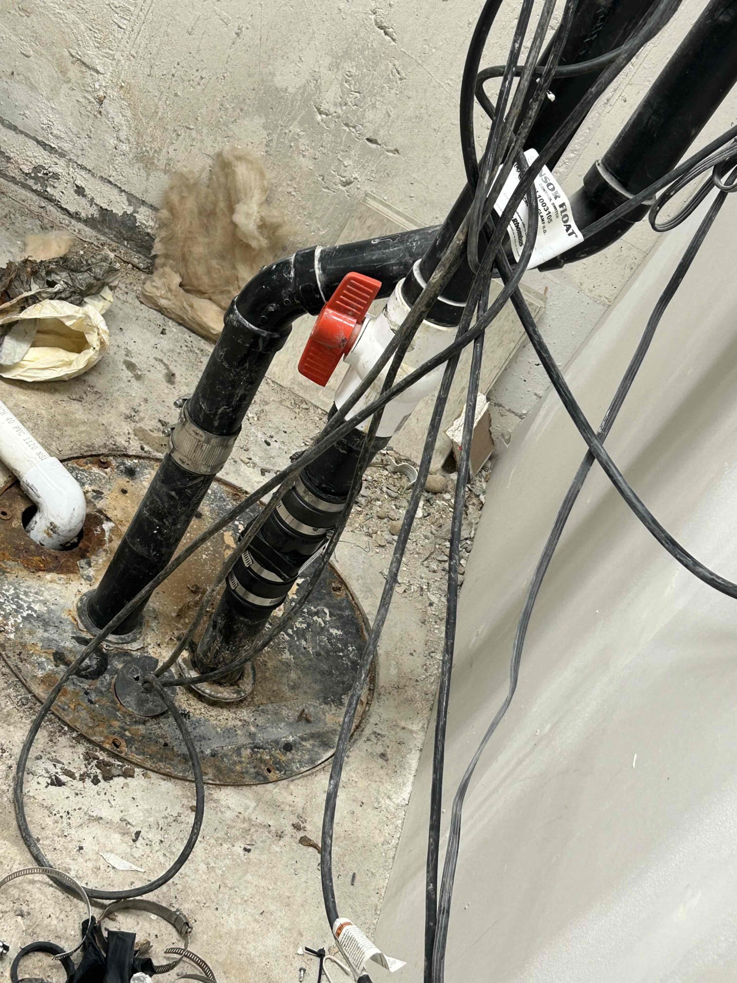 Image of a sparkling clean commercial space after same-day sewage backup recovery. A worker is shown pumping a septic tank outside, highlighting the source of the problem being efficiently resolved. The scene emphasizes a fast, effective solution to sewage issues, preventing business disruption.