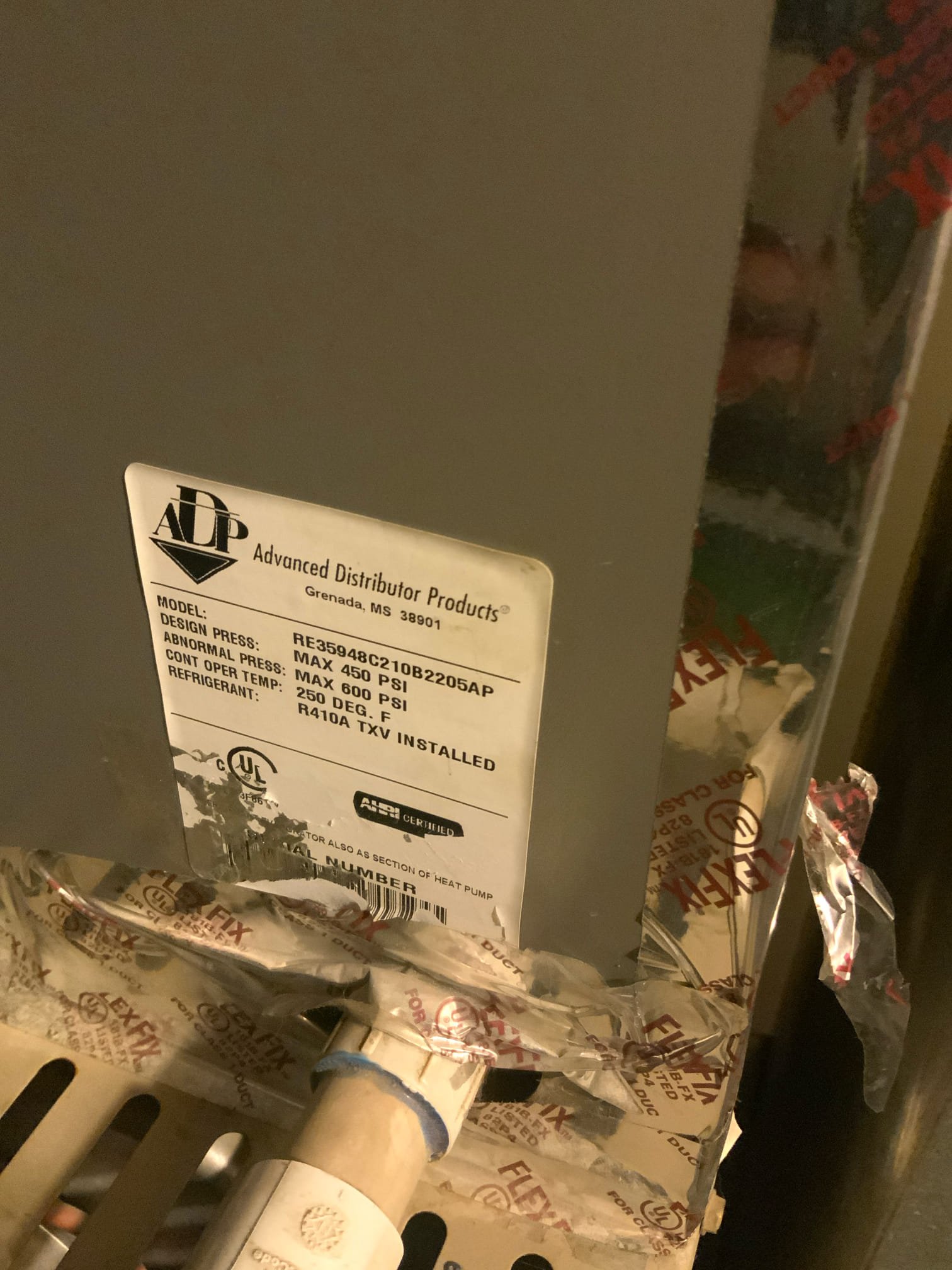 A pristine commercial building exterior. Gleaming, modern HVAC units are subtly visible on the roof, suggesting efficient and reliable climate control. The building's bright, welcoming windows hint at comfortable, productive occupants inside, showcasing the benefits of professional commercial air conditioning installation and service.