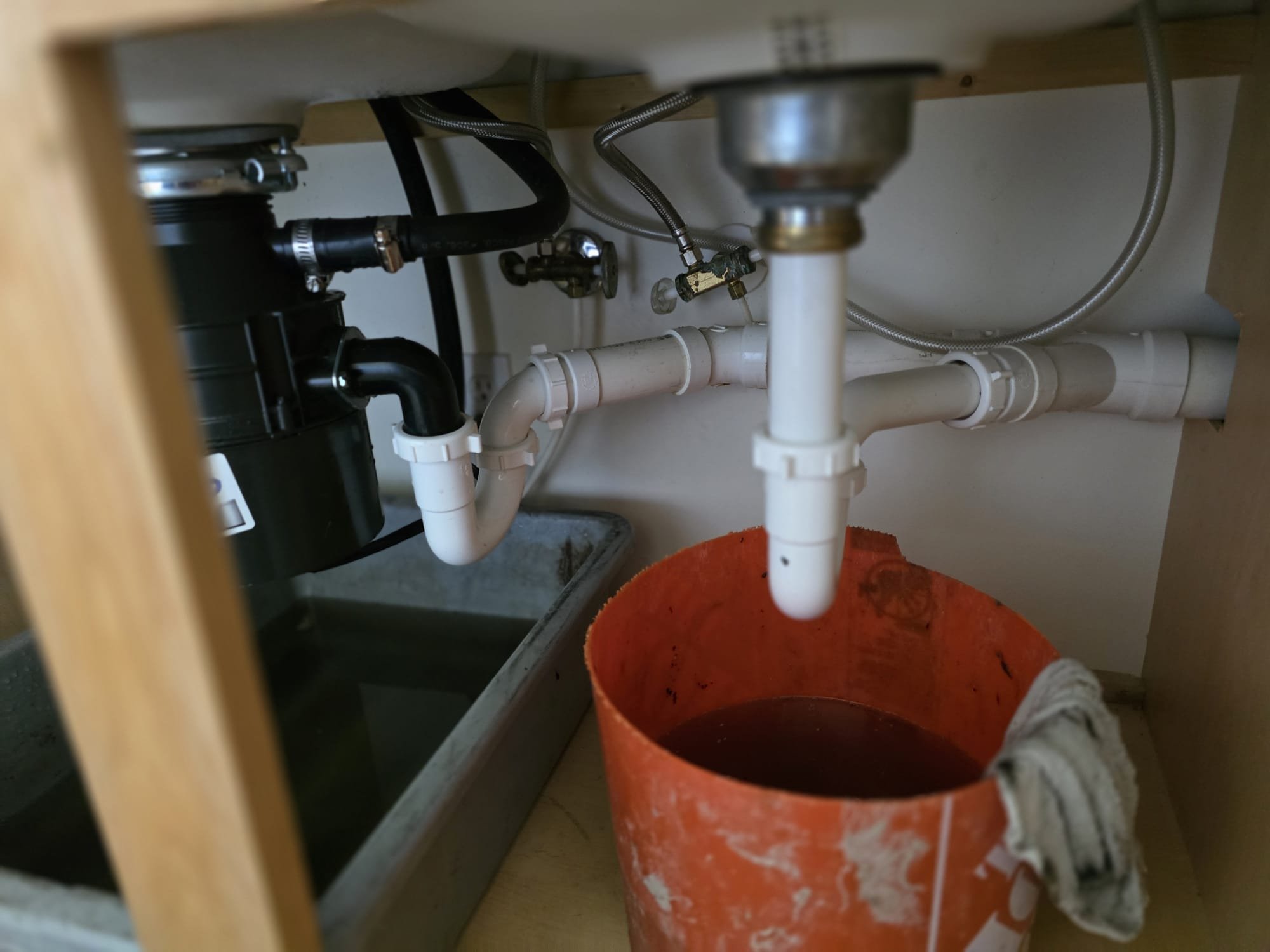 Residential sewage backup cleanup in progress. An air purifier with a cleanable filter helps improve air quality during the repair, ensuring a healthier environment after the sewage damage is remediated.