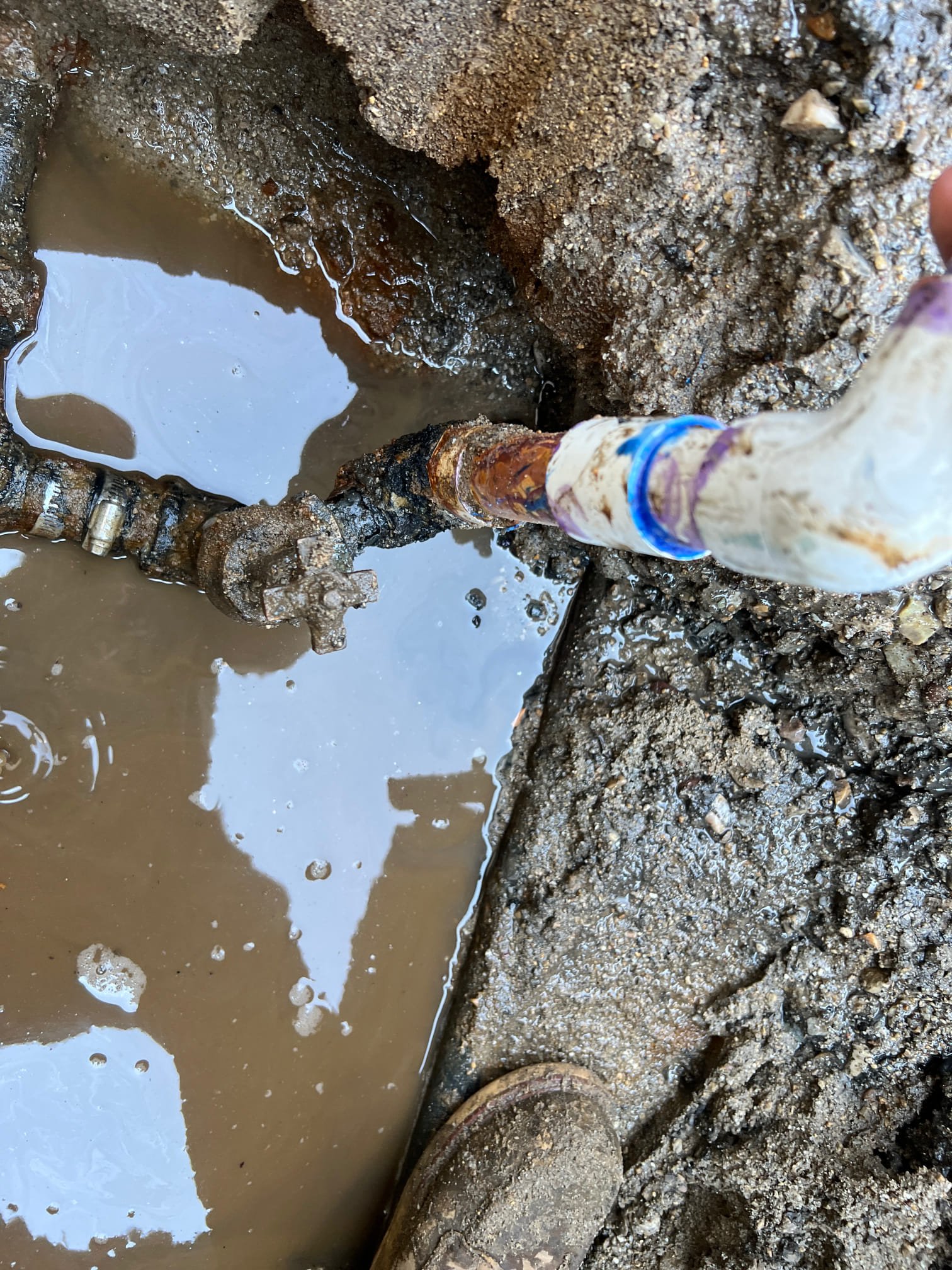 Image depicting water damage restoration services addressing ceiling leaks caused by plumbing issues like a clogged kitchen sink. Professional cleanup and repair are crucial to prevent further structural damage and mold growth.