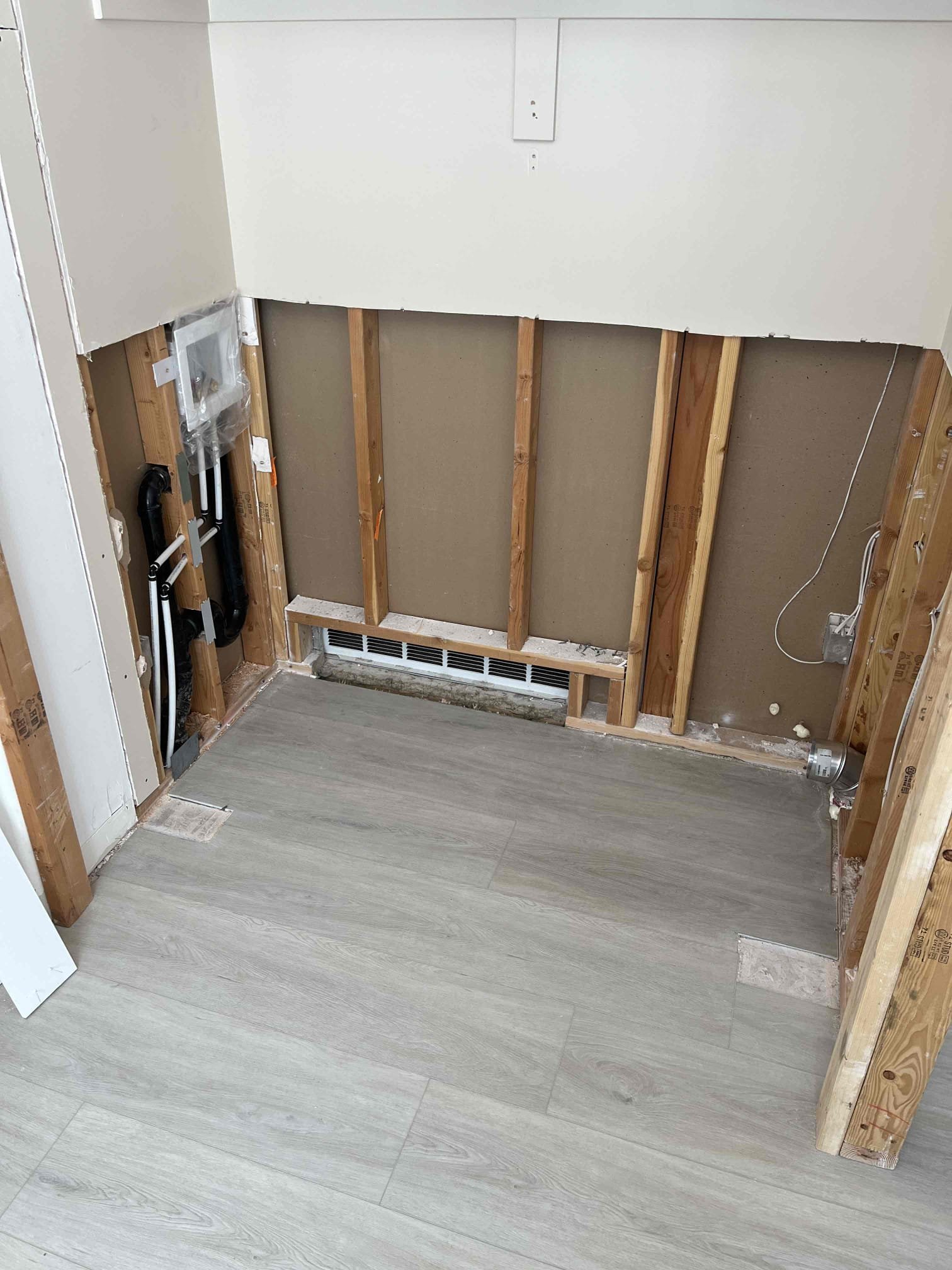 Image depicting a homeowner searching for an affordable plumber near me, possibly related to residential plumbing replacement services. Focus is on finding reliable and cost-effective plumbing solutions.