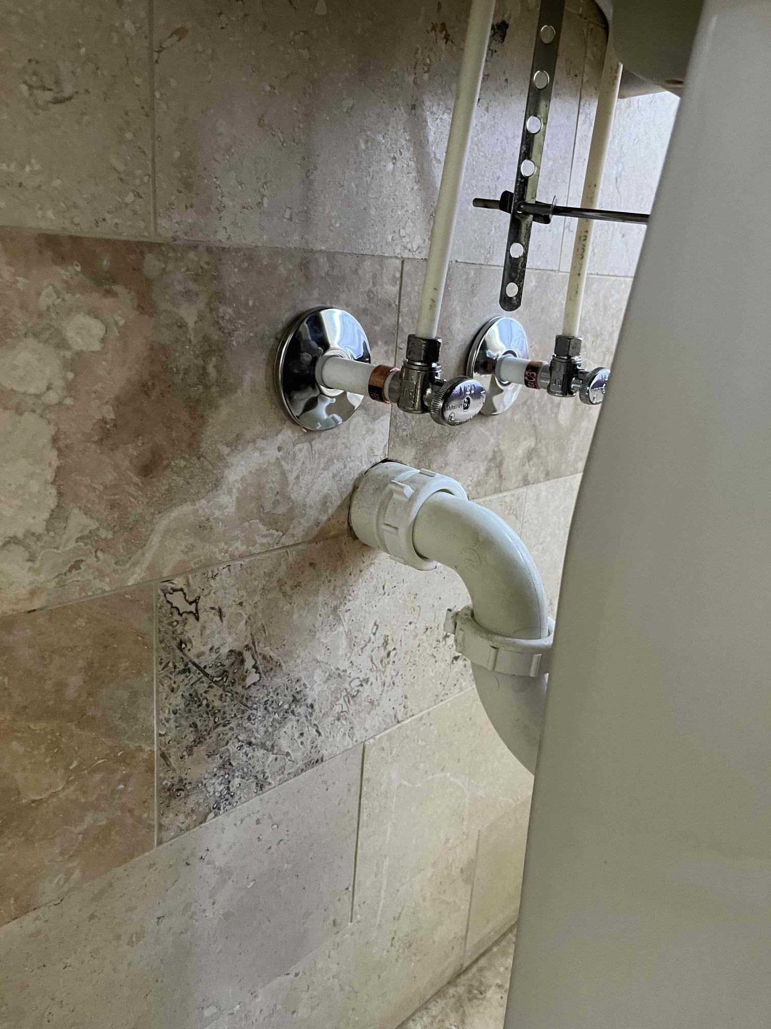 Clean, clear water flowing from various whole house filtration systems, preventing scale buildup on appliances and pipes, contrasting with a before-and-after image of a sparkling clean floor and a home protected from potential flood damage. Illustrates the long-term benefits of water filtration for household maintenance.