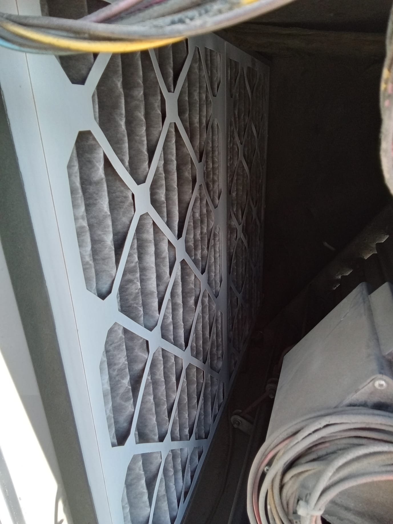 Image of a technician in a clean uniform efficiently repairing a commercial HVAC unit. The backdrop showcases a modern office building, implying reliable service for businesses. Bright, cool air is subtly visualized, suggesting improved comfort and productivity. Text overlay: 'Commercial Air Conditioning Service Near Me' and 'Air Repair Heating & Air Conditioning'.
