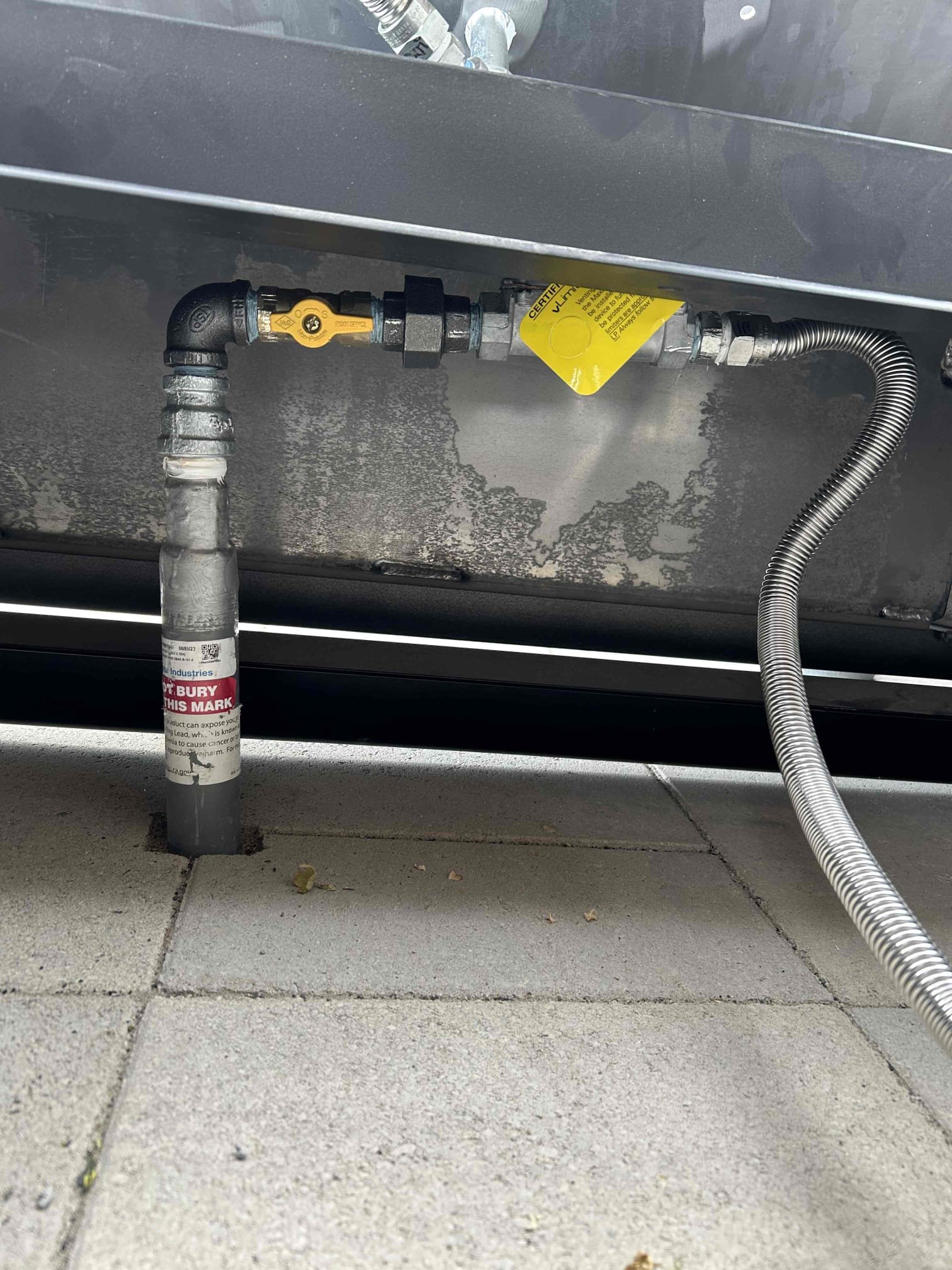 Close-up of a clean, modern sink with a shiny chrome plug, implying easy drainage and no leaks. This contrasts with the blurry background suggesting a leaky tub faucet, highlighting the benefits of proper faucet installation and repair to avoid water waste and damage.