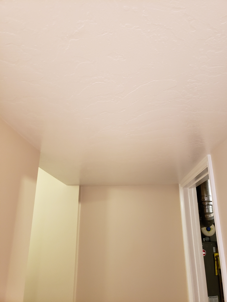 A pristine white air purifier, essential for removing airborne grease and odors, similar to the services offered by grease removal companies and commercial storm and disaster odor removal services. Ideal for maintaining a clean and healthy indoor environment.