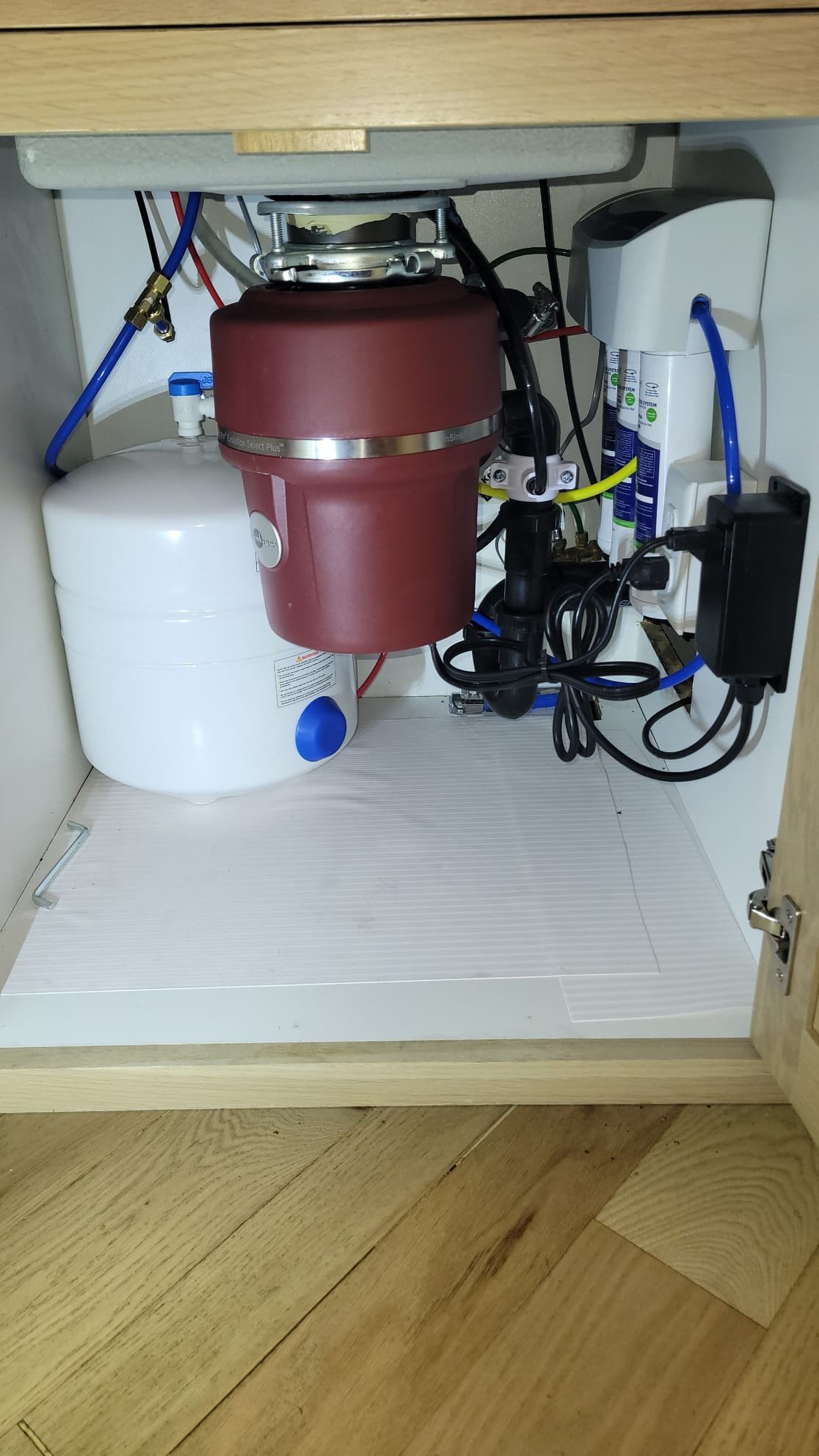 A sparkling faucet dispensing clear water, symbolizing the benefits of water softener tune-ups. Visual emphasis on the absence of calcium buildup, highlighting the maintenance and installation services that ensure clean, soft water.