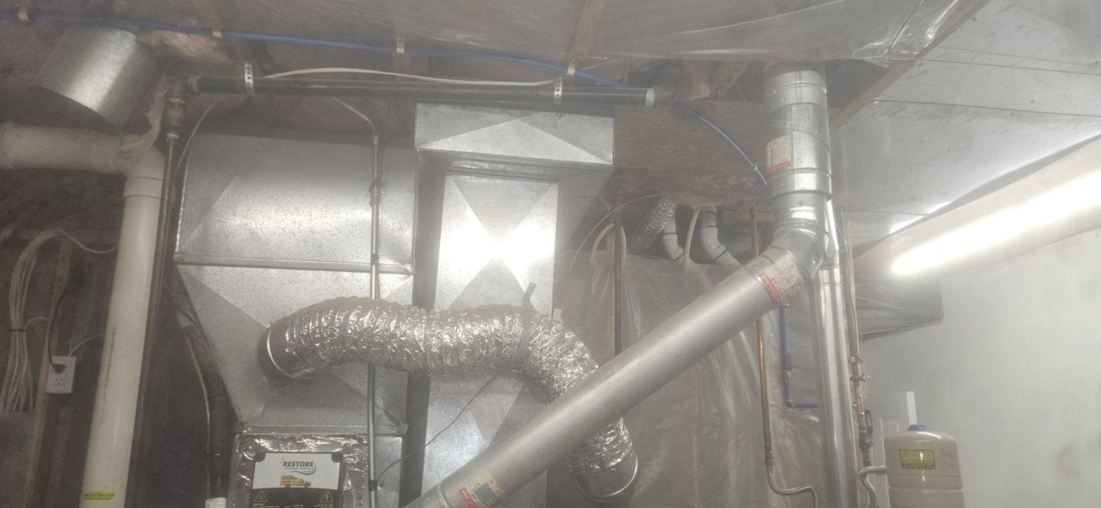 Close-up of a Pfister Pasadena lavatory faucet with a gleaming sink stopper in the closed position, showcasing its tight seal. The faucet's elegant design complements the stopper's functionality, preventing water leakage and highlighting the sink's water-saving benefits.