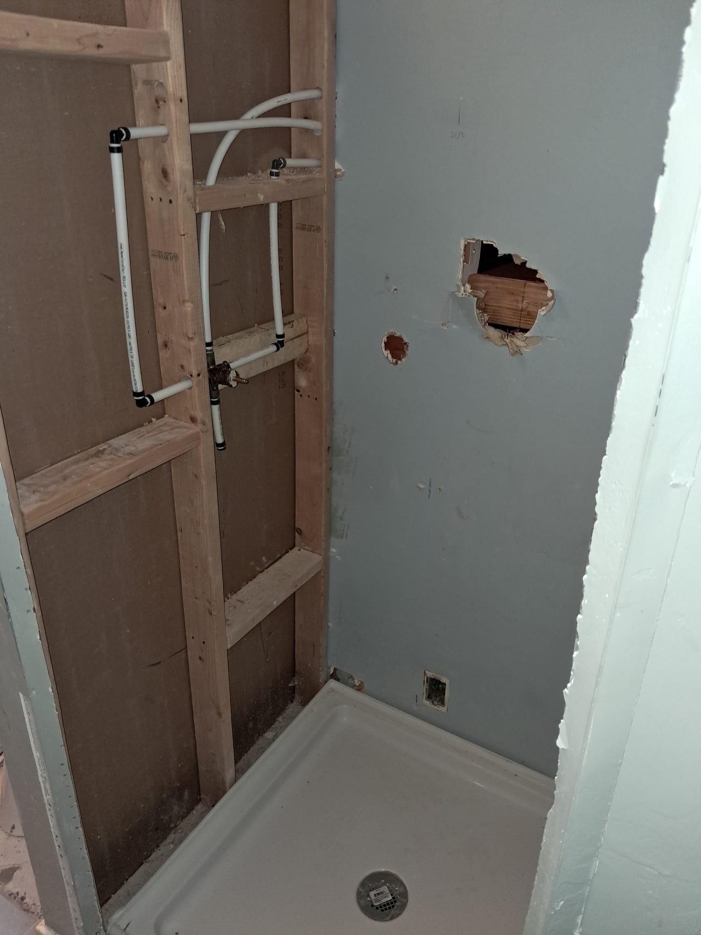 Close-up of various shower drain replacement parts, essential for fixing or replacing a faulty shower drain. Consider a complete replacement drain if parts are heavily corroded. If you're experiencing persistent drainage issues, especially with septic systems, search for 'septic drain field replacement near me' to address potential broader problems.